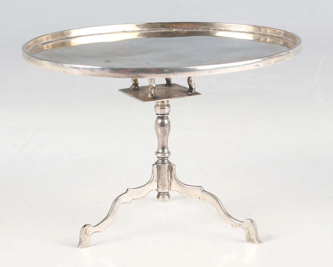 An early 18th century Dutch miniature toy silver oval tilt-top table
