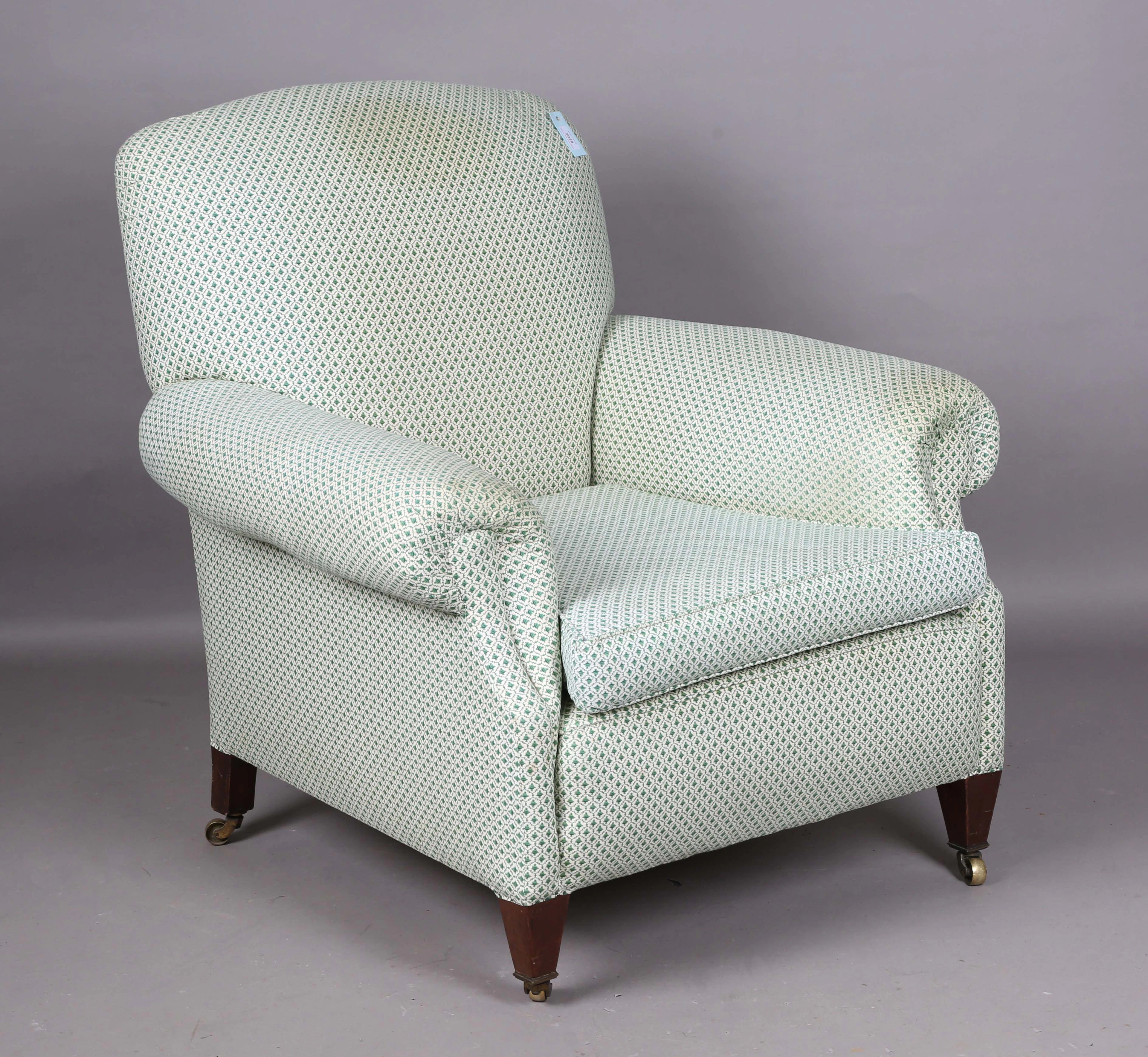 An Edwardian deep-seated armchair, in the manner of Howard & Sons