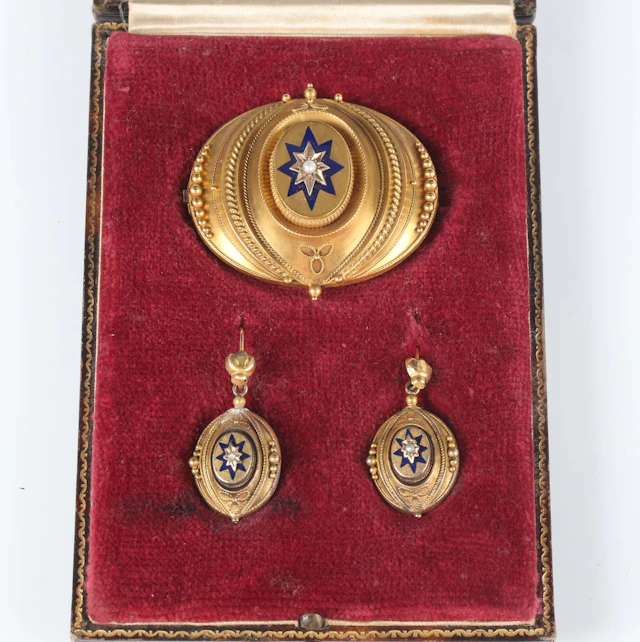 A Victorian gold, blue enamelled and seed pearl demi-parure, comprising