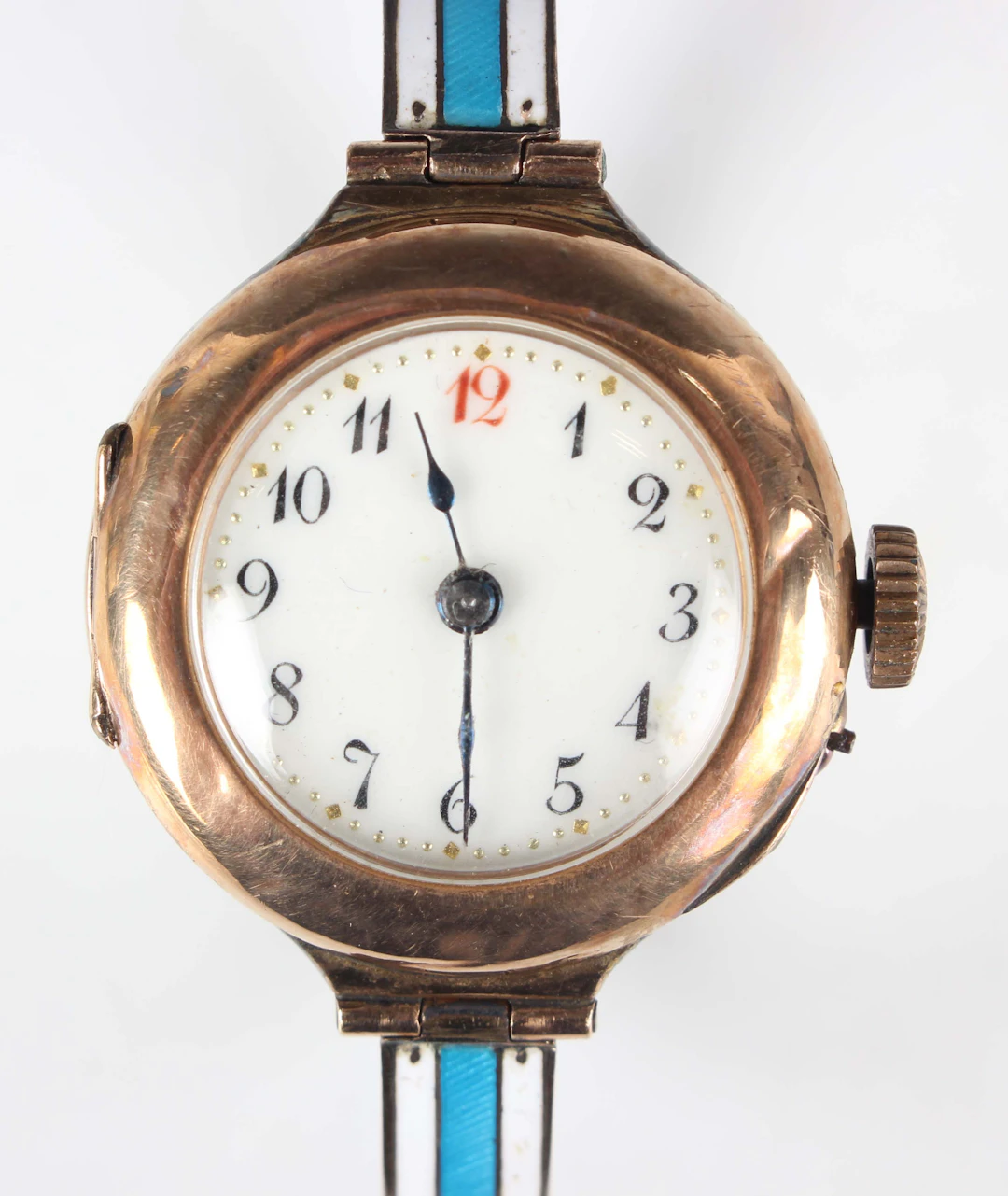A 9ct gold and enamelled lady's oval bangle wristwatch with unsigned