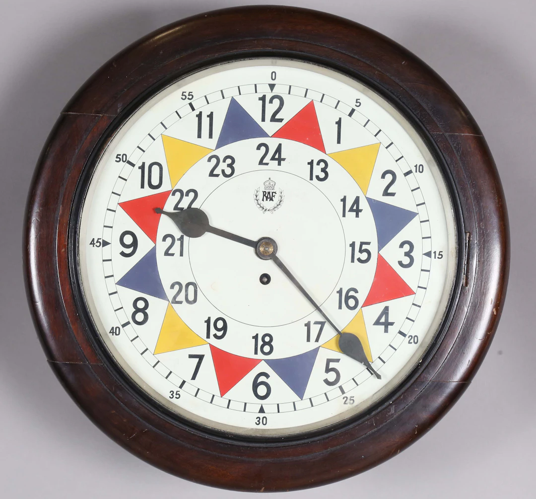 A mid-20th century RAF sector style wall clock with single train movement