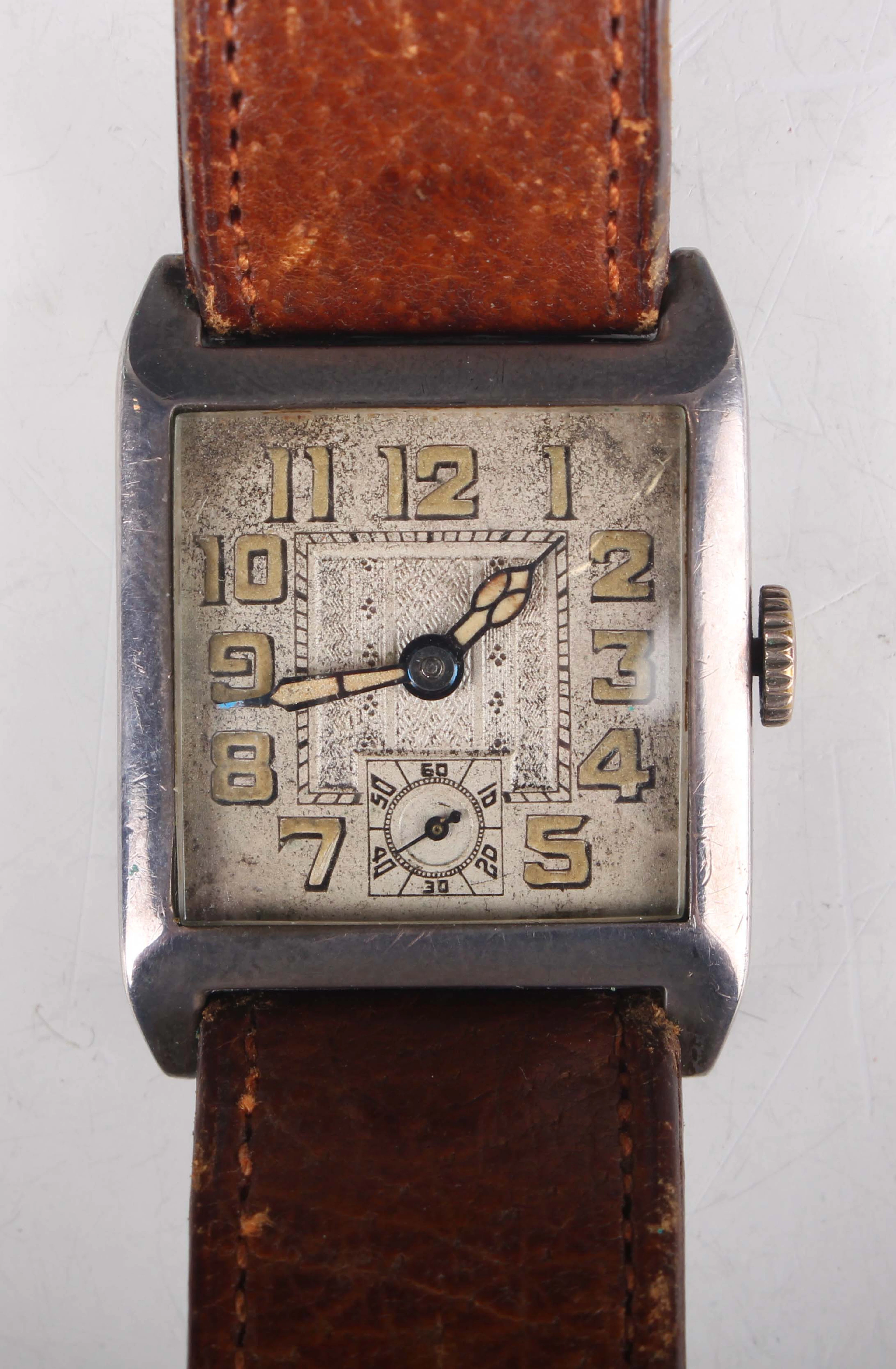 A silver square cased gentleman's wristwatch, the jewelled movement
