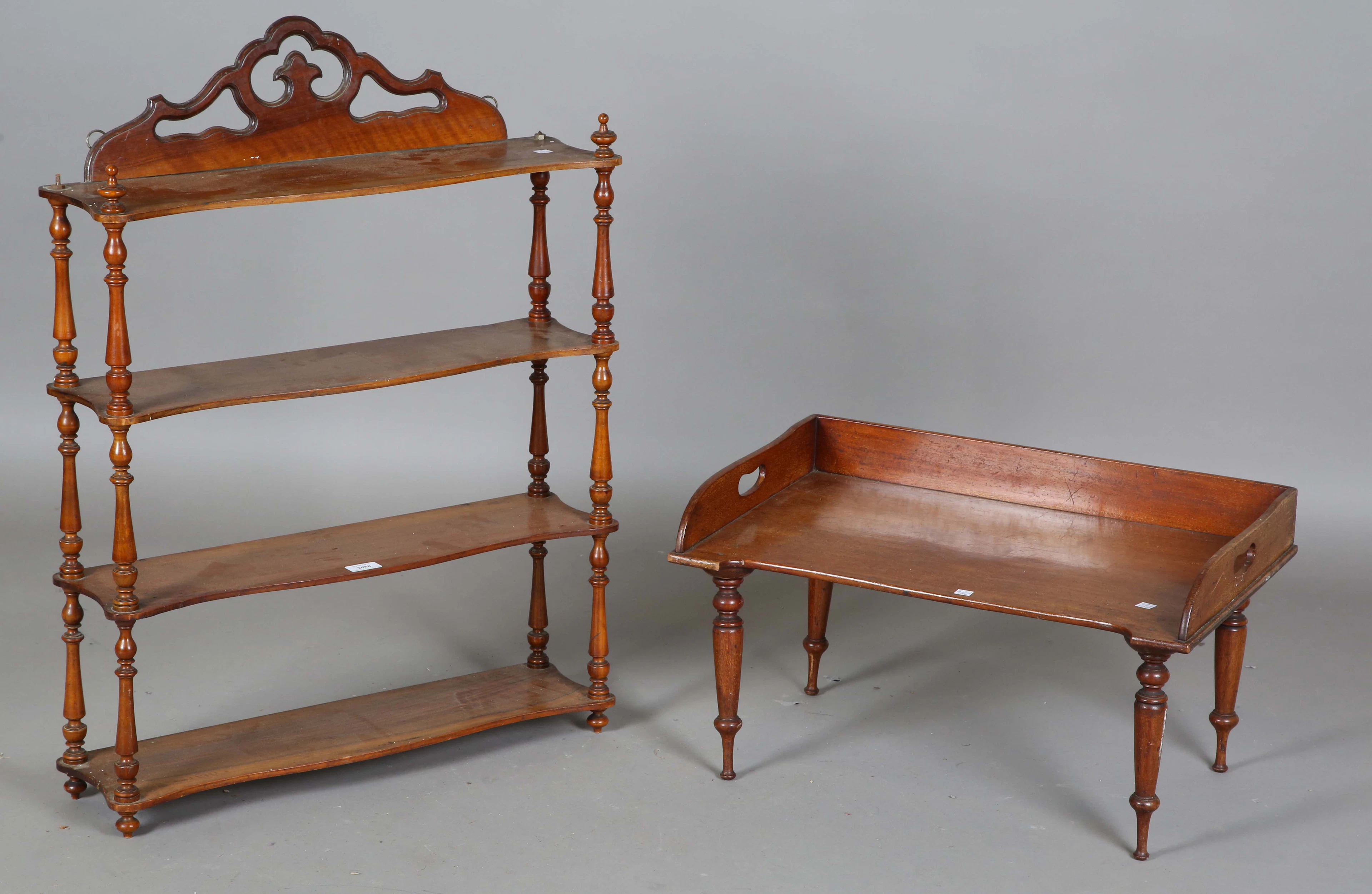 A mid-Victorian walnut four-tier wall shelf, height 85cm, width 65cm