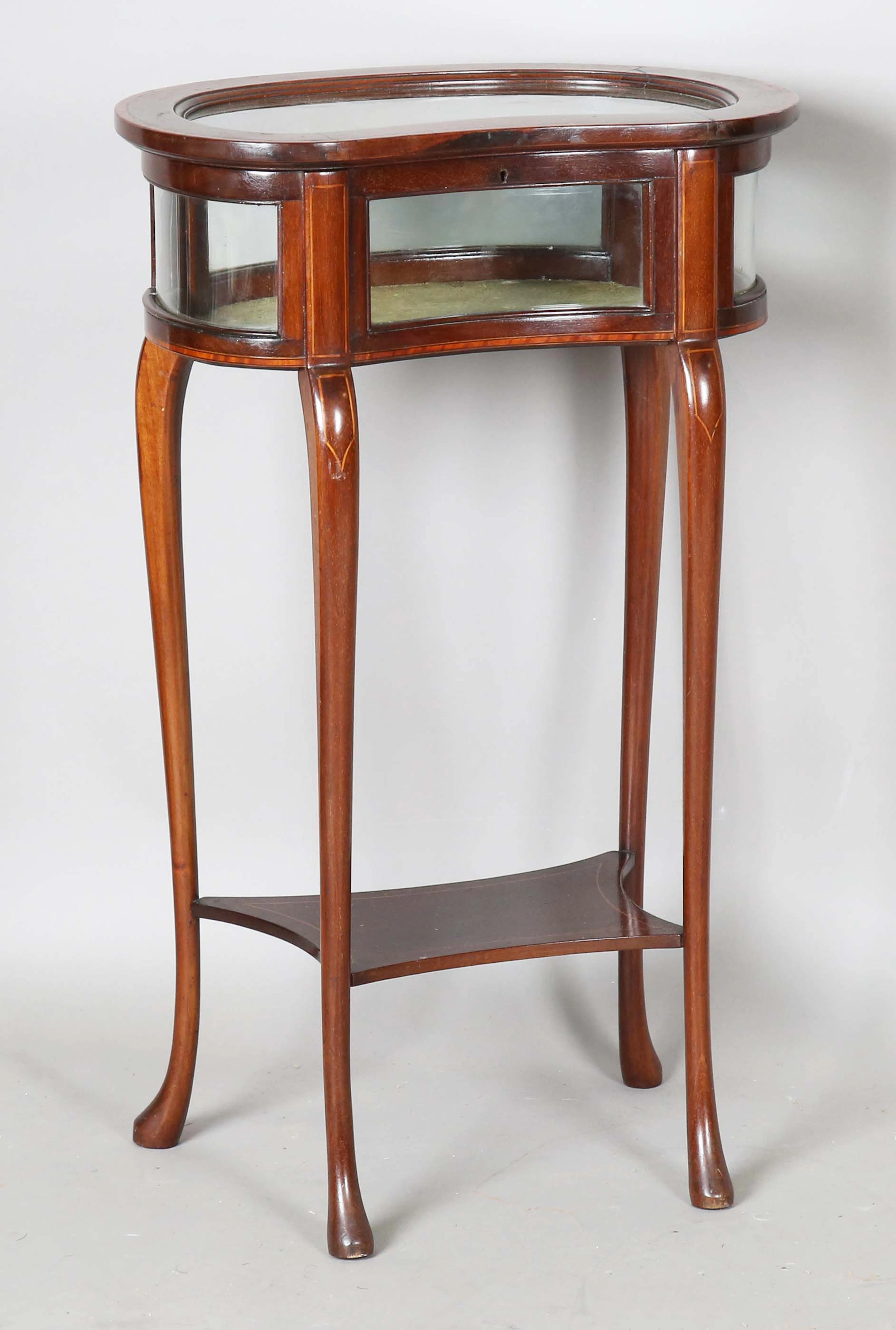 A small Edwardian mahogany kidney-shaped bijouterie table with satinwood