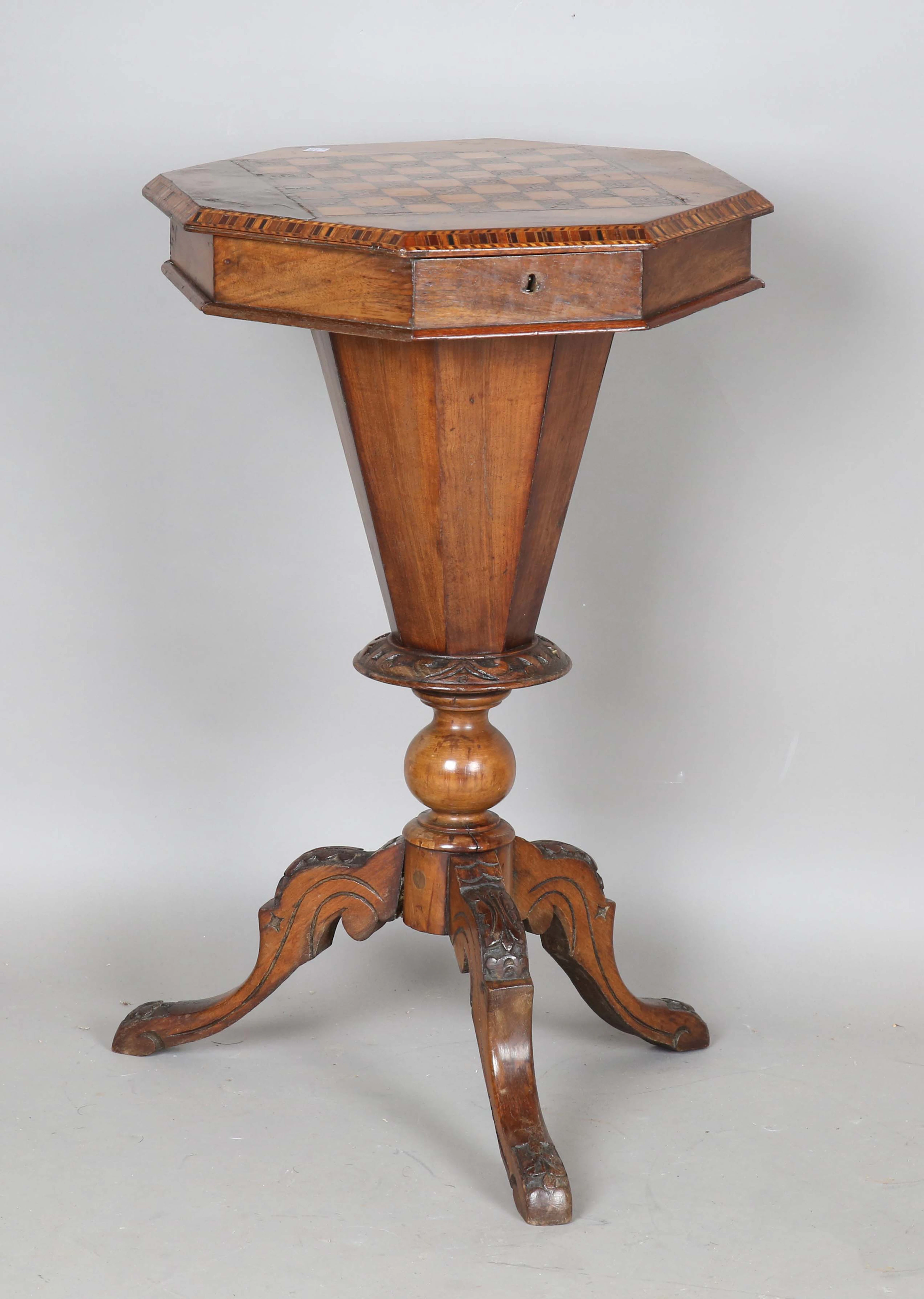 A Victorian walnut work table, the hinged top inlaid with a chessboard