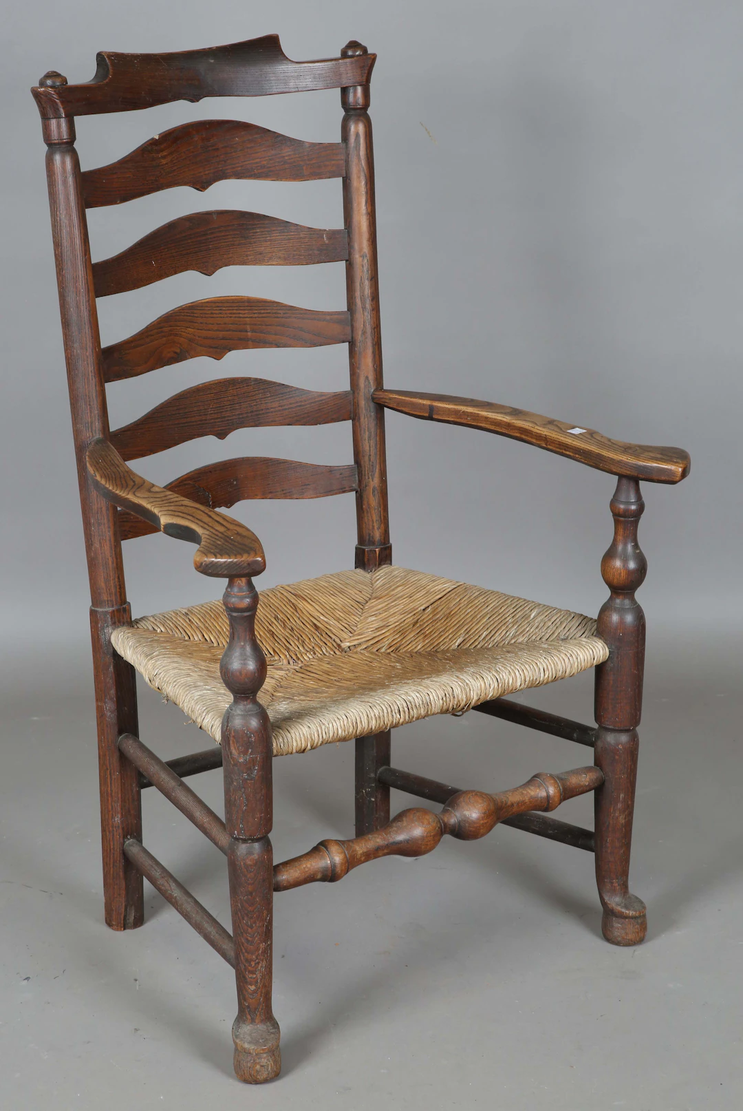 An 18th century provincial ash and elm armchair with rush seat, height