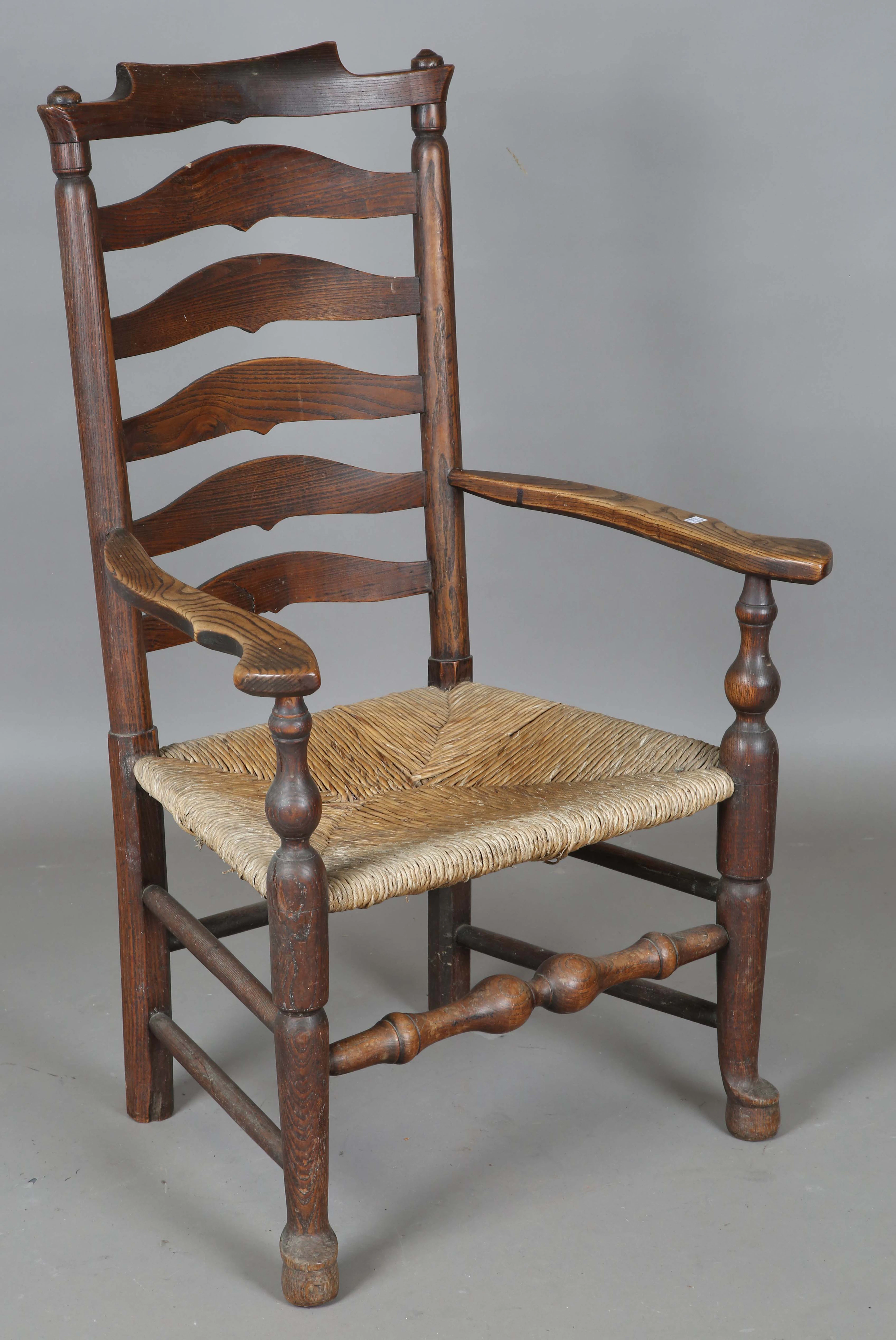 An 18th century provincial ash and elm armchair with rush seat, height