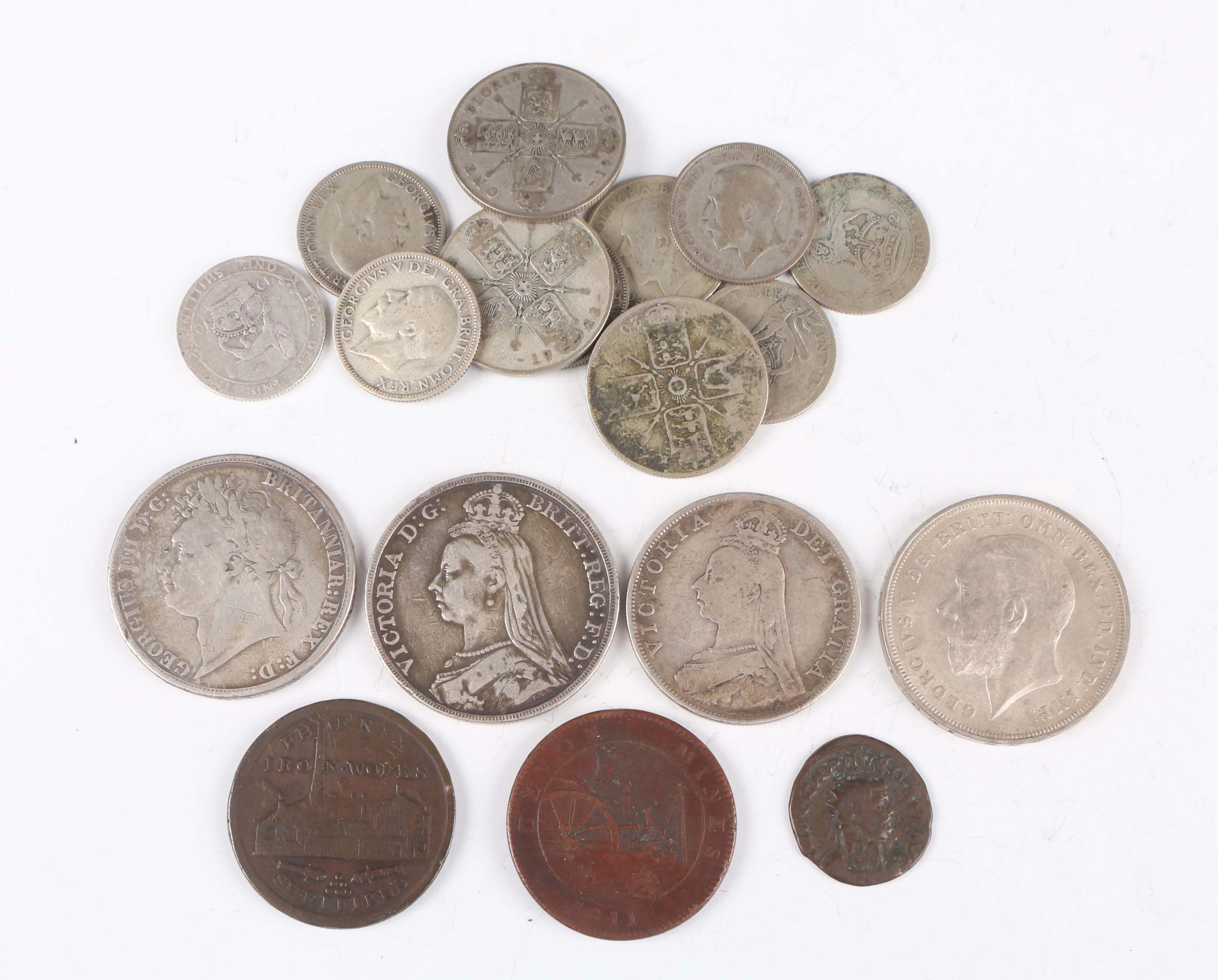 A collection of European coins and banknotes, including a George IV