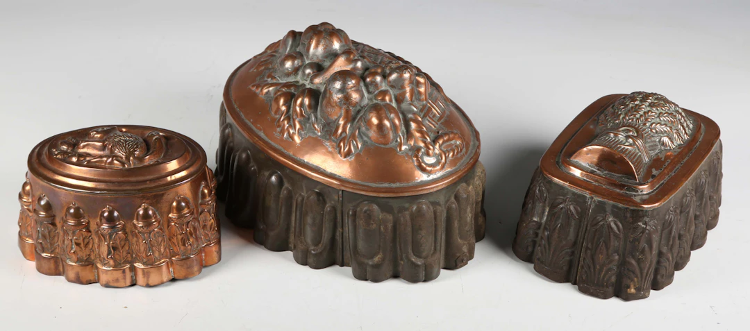 A Victorian copper jelly mould, embossed with a squirrel eating an