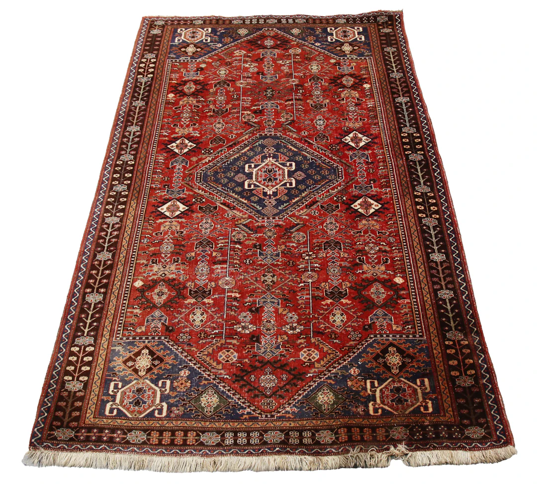 A South-west Persian rug, early 20th century, the red field with an