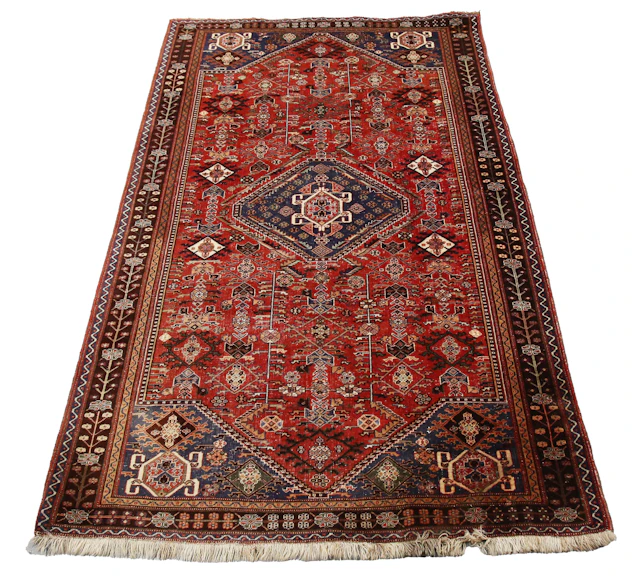 A South-west Persian rug, early 20th century, the red field with an