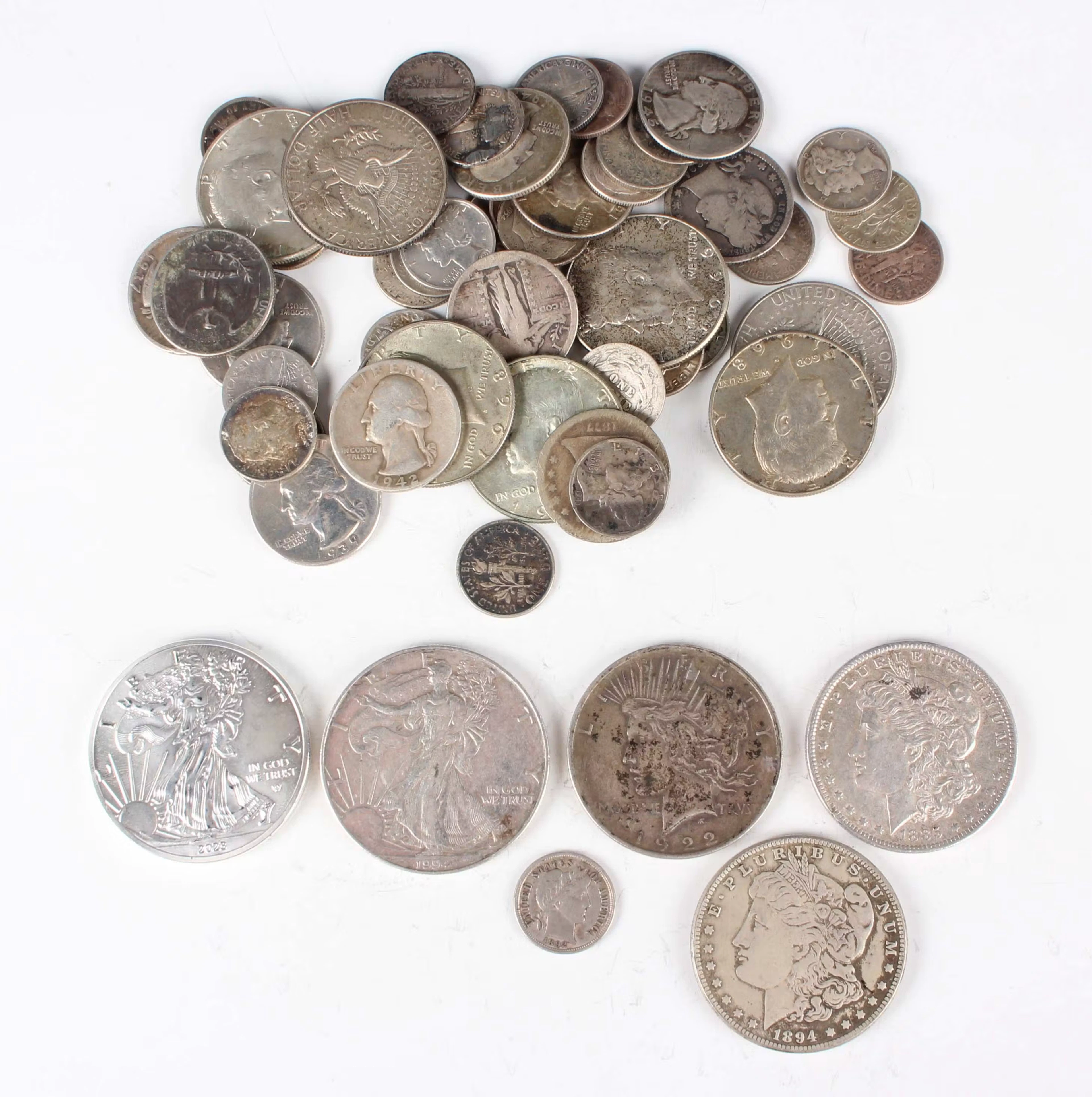 A small collection of USA silver and base metal coinage, including