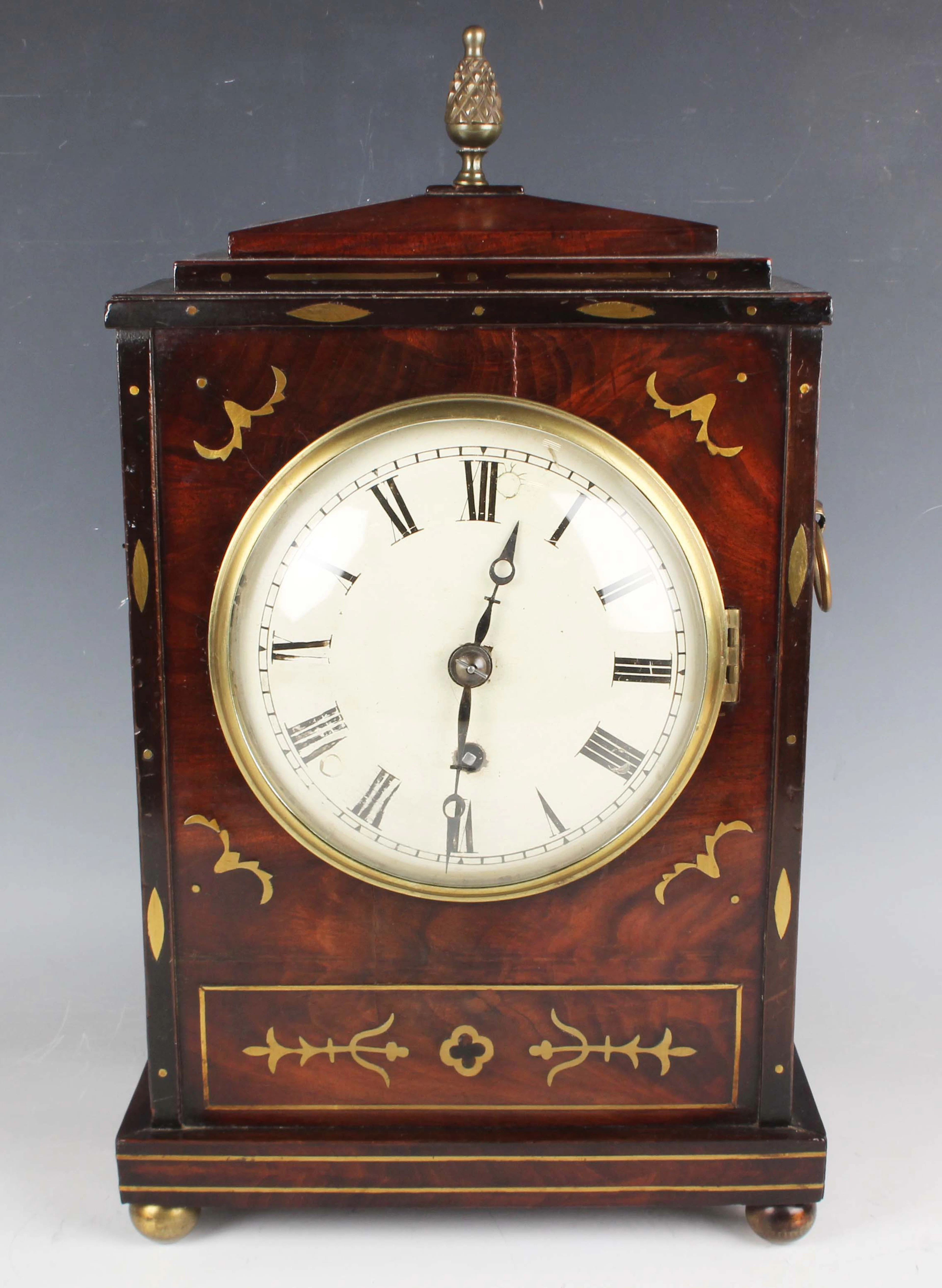 A Regency brass mounted and inlaid mahogany cased bracket timepiece