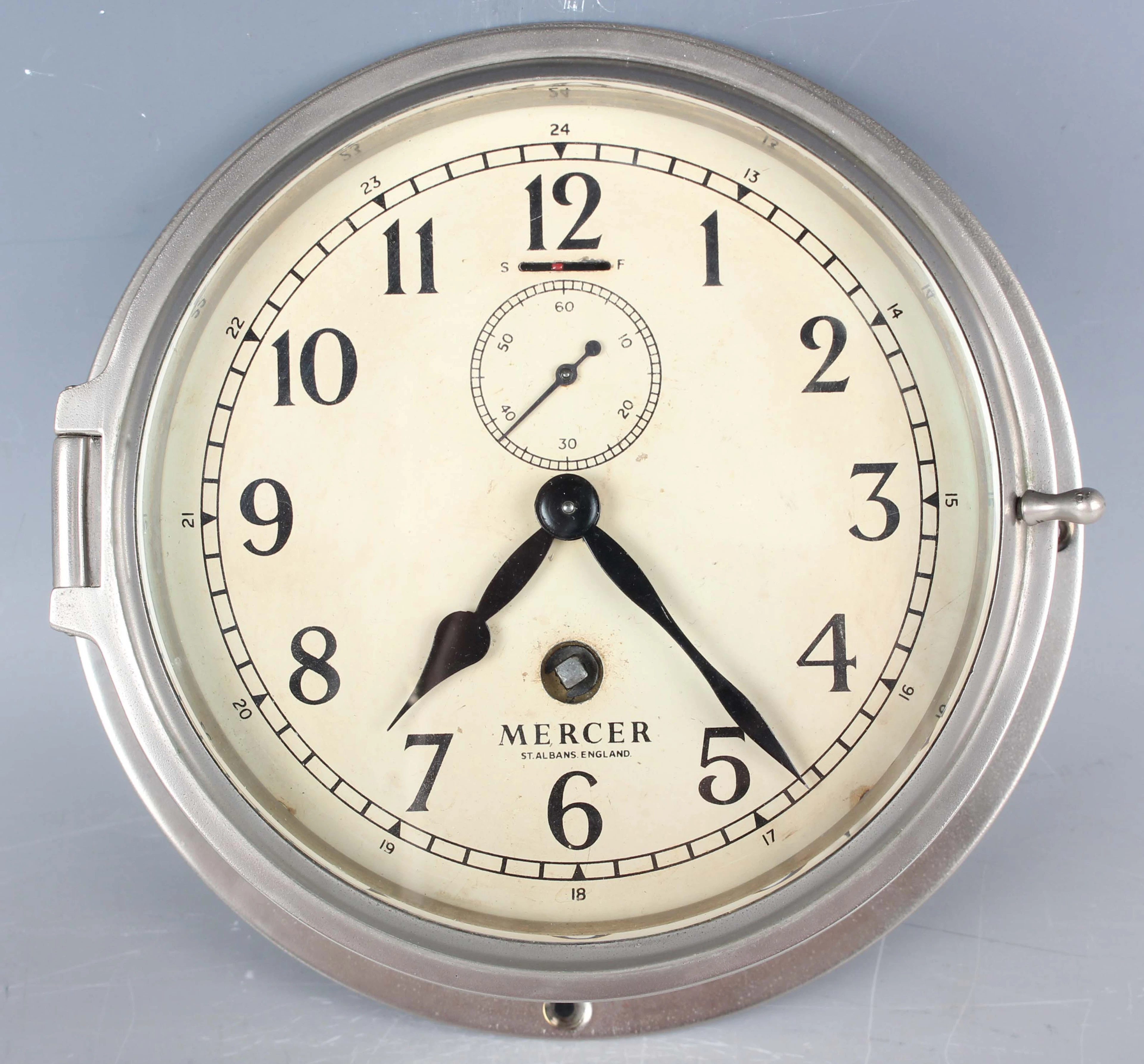 A 20th century silvered brass cased ship's style wall timepiece, the