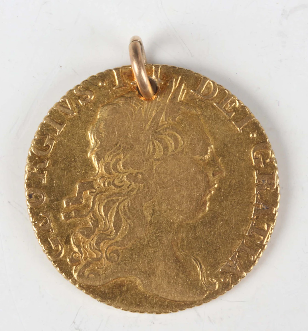 A George III guinea 1772, third laureate head, crowned shield of arms