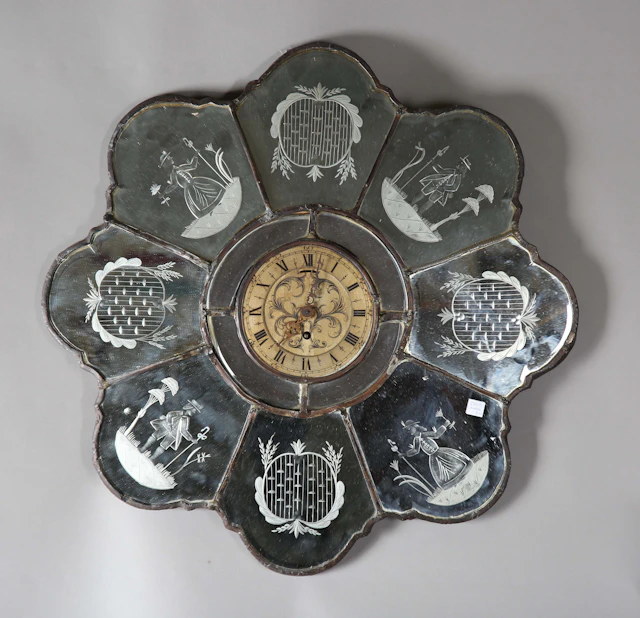 A late 19th/early 20th century Venetian mirror with central circular