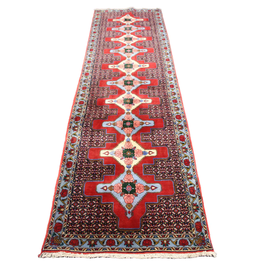 A Senneh runner, South Persia, late 20th century, the red field with