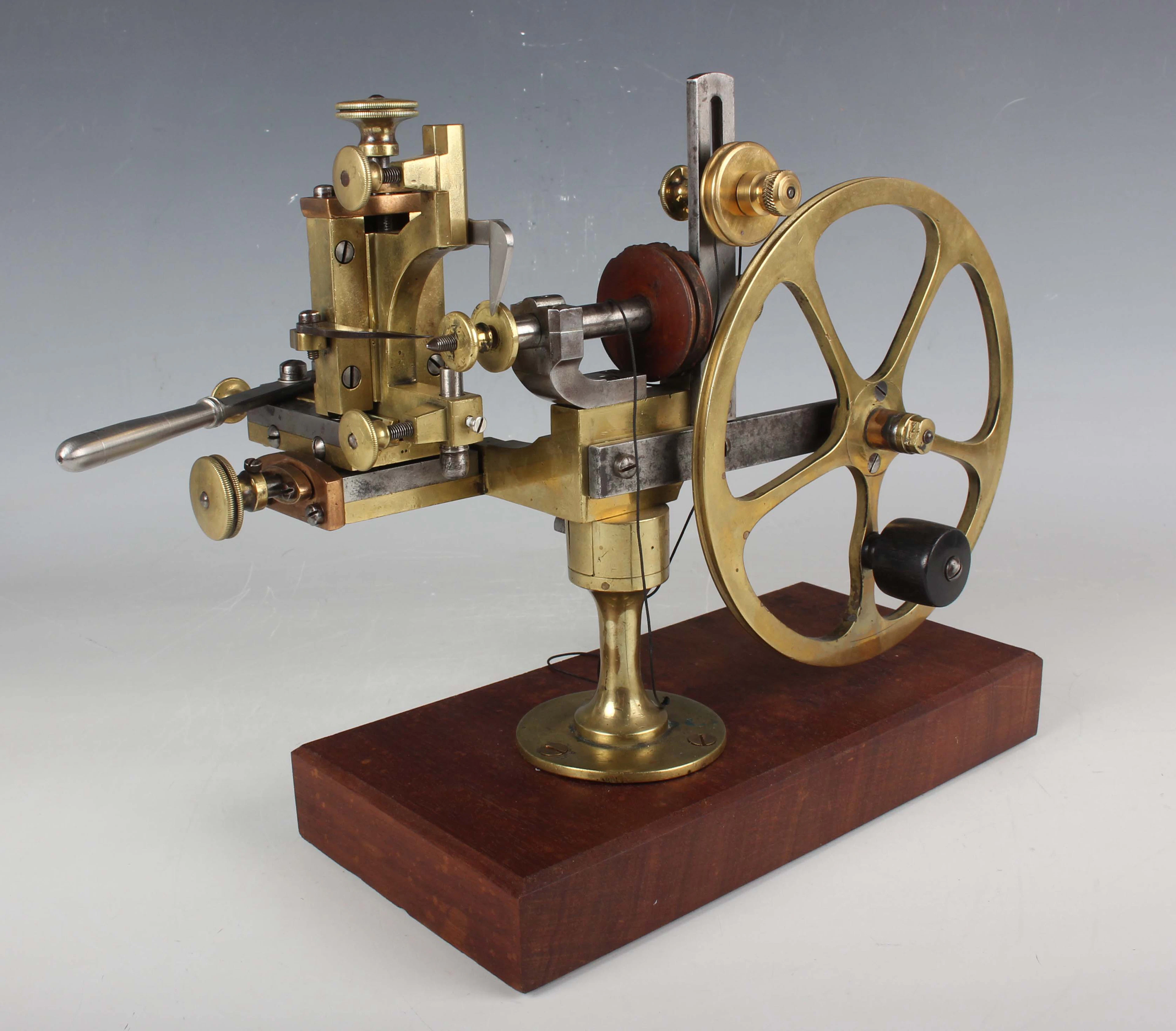 A late 19th century brass and steel watchmaker's topping tool, mounted