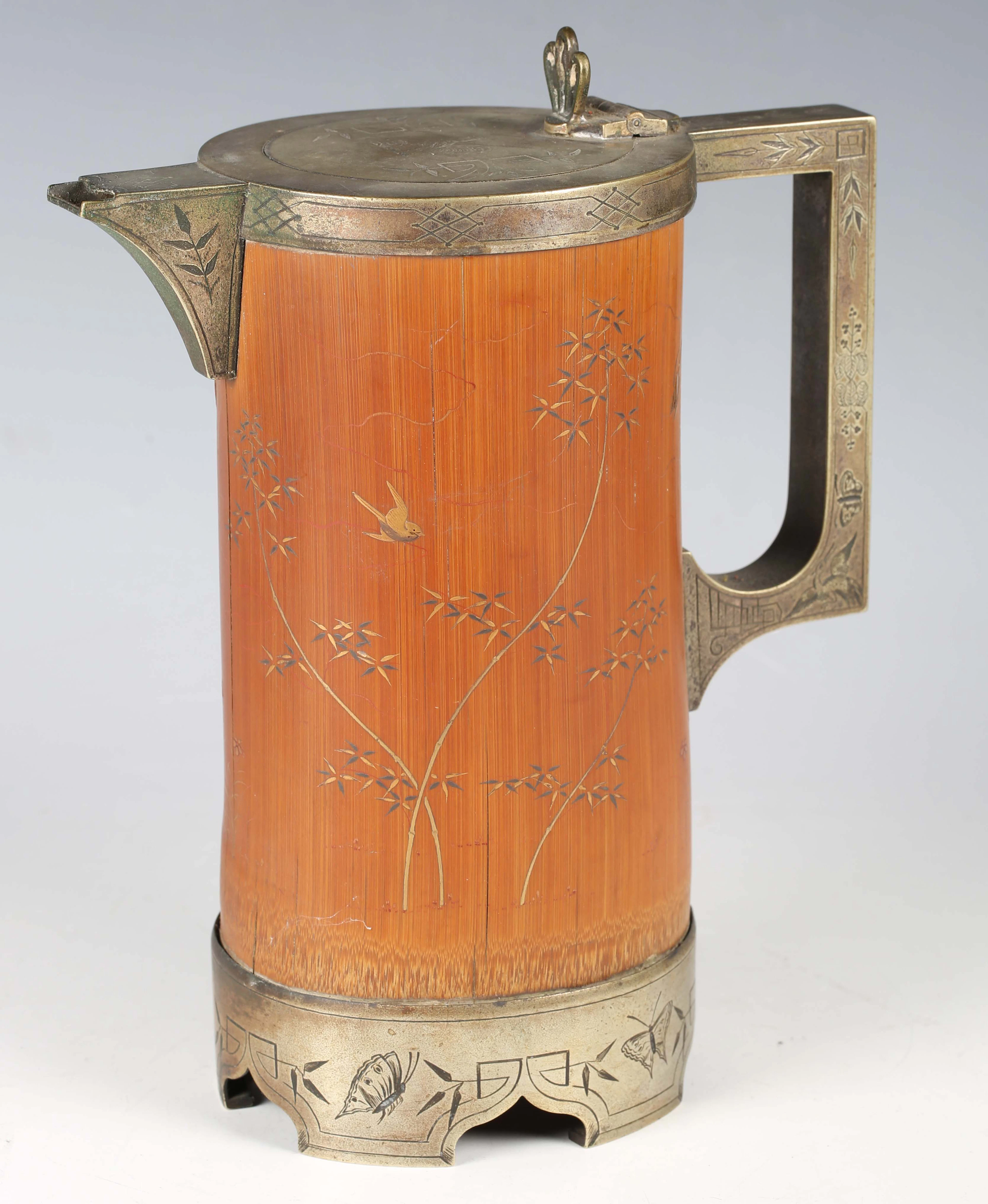 A late Victorian Aesthetic Movement plate mounted bamboo water jug