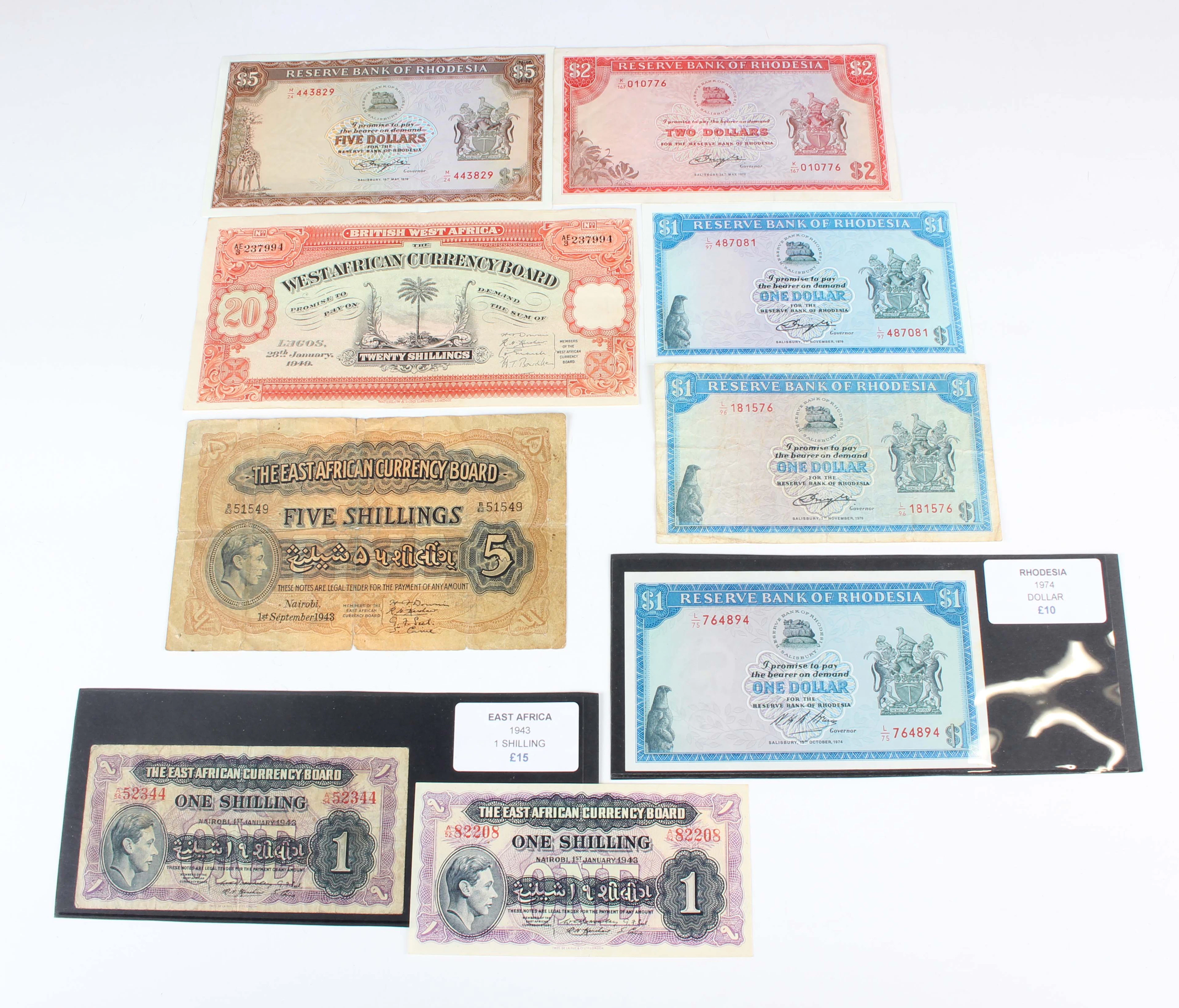A small group of banknotes, including East African Currency Board