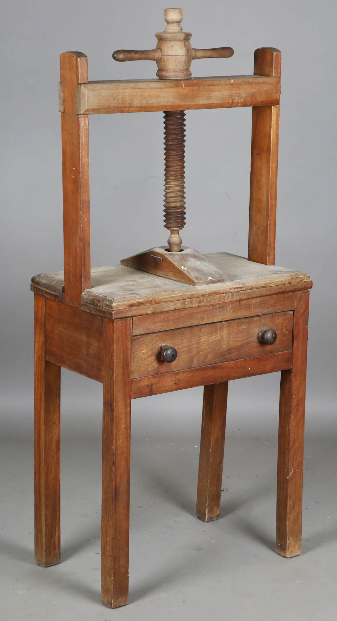 An early Victorian provincial fruitwood bookpress with table stand