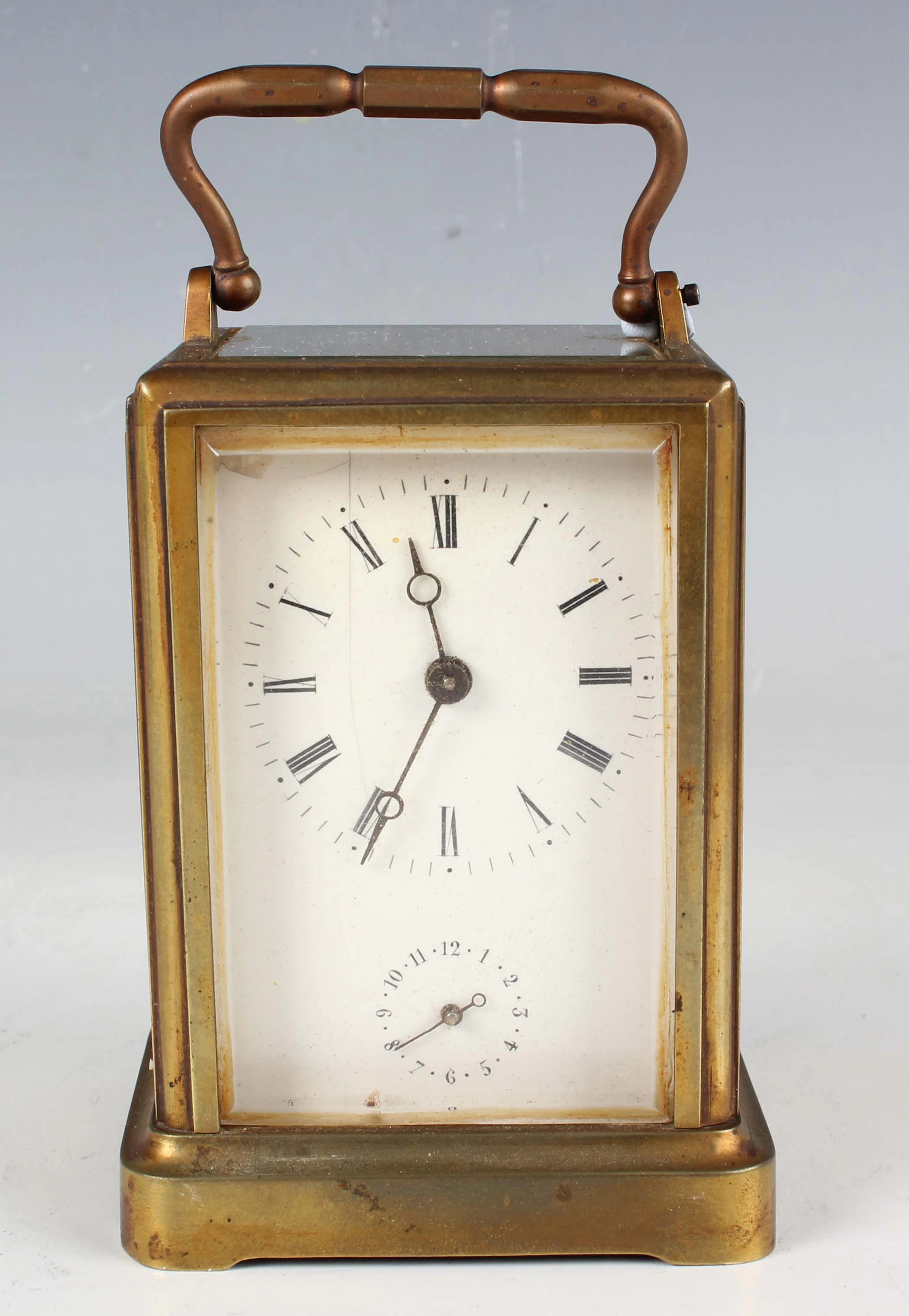 A late 19th century French brass one piece cased carriage alarm clock