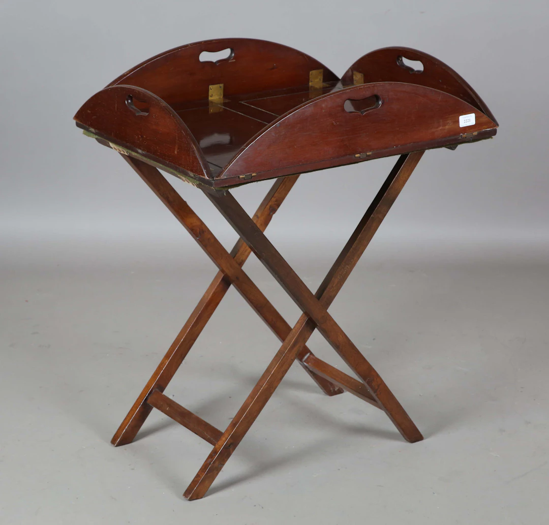 A 19th century mahogany butler's tray with gilt brass hinges and pierced