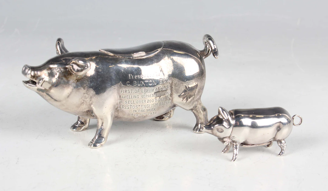 An early 20th century silver pig creamer, modelled standing with curled