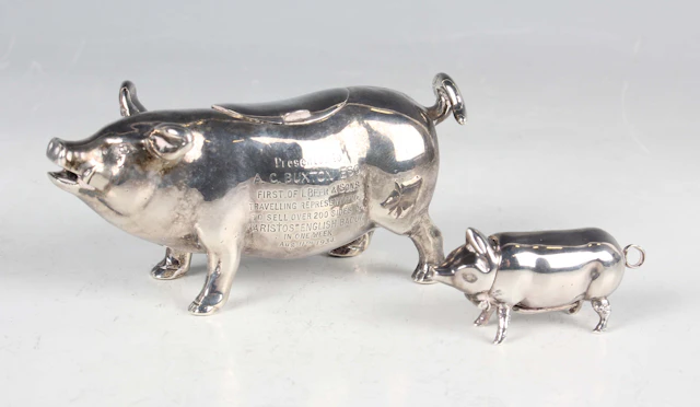 An early 20th century silver pig creamer, modelled standing with curled