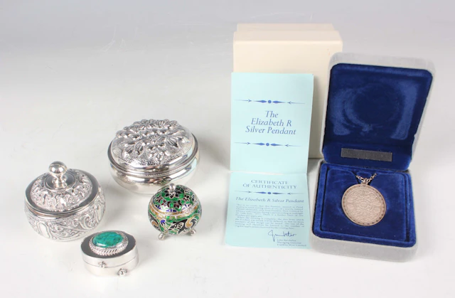 A Continental .925 silver circular box and cover, decorated in relief