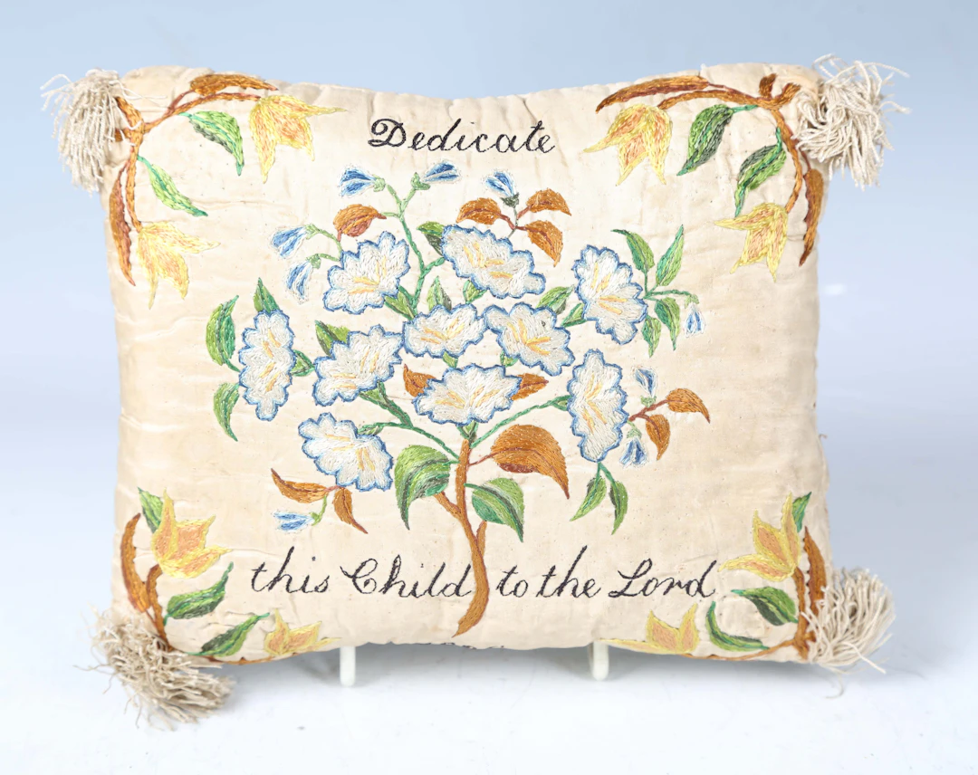 A Regency silk embroidered christening pillow, both sides finely embroidered