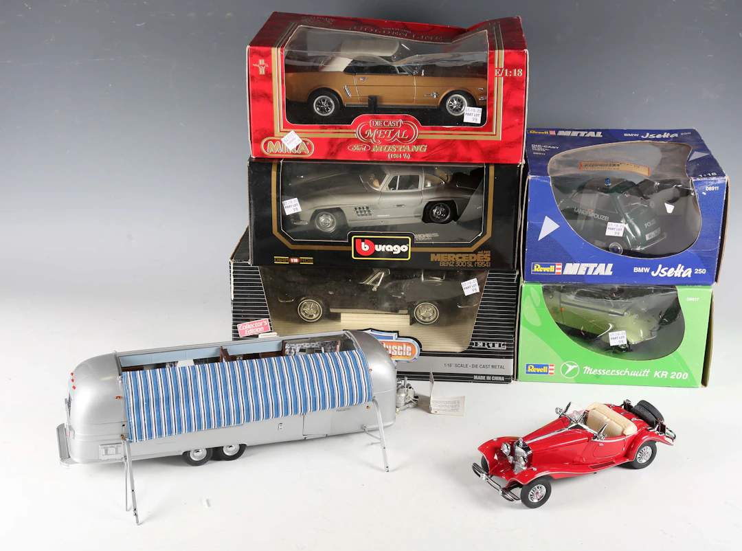 A small group of model vehicles, comprising Franklin Mint Mercedes