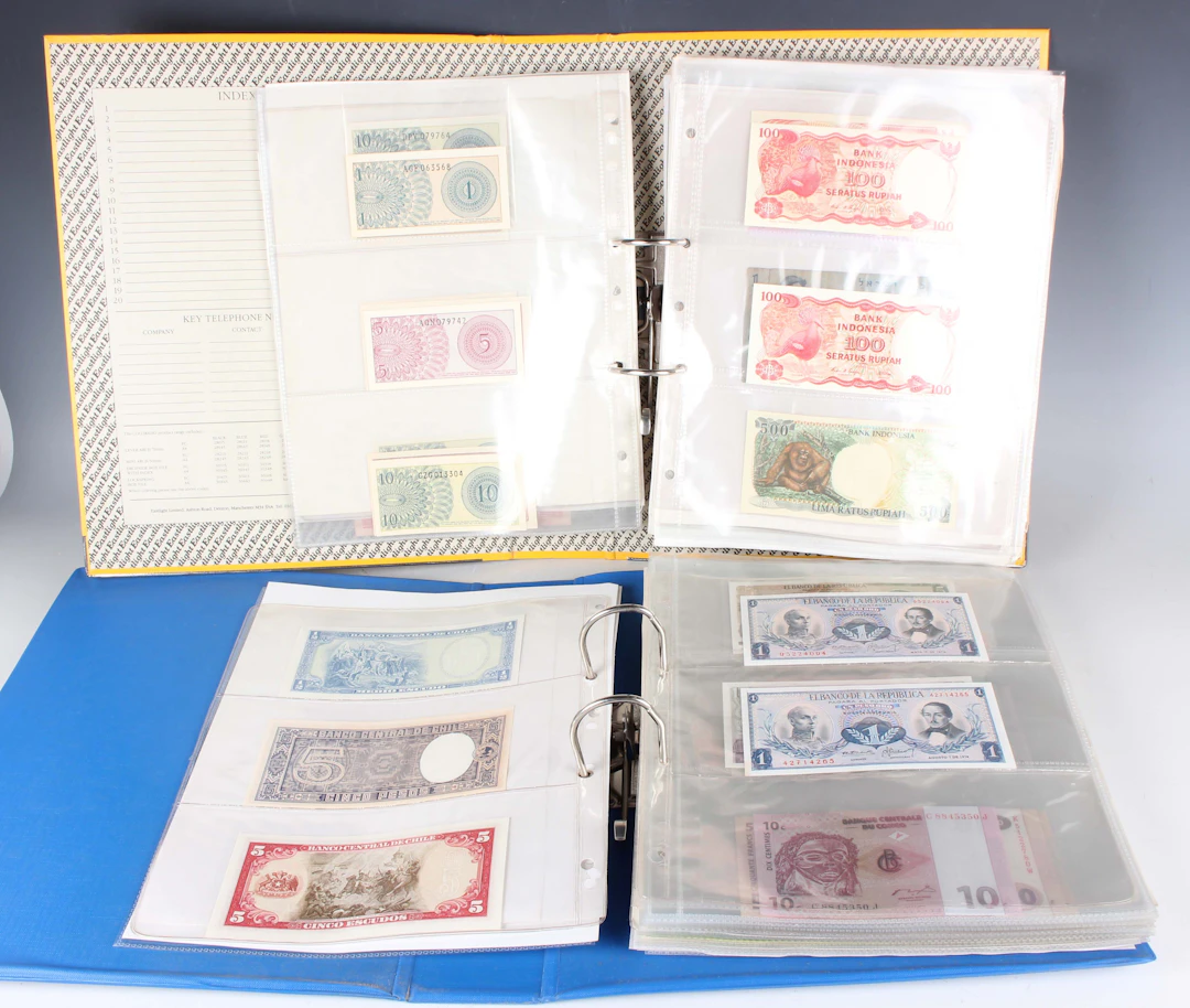 A large collection of European and world banknotes, including Landsbanki