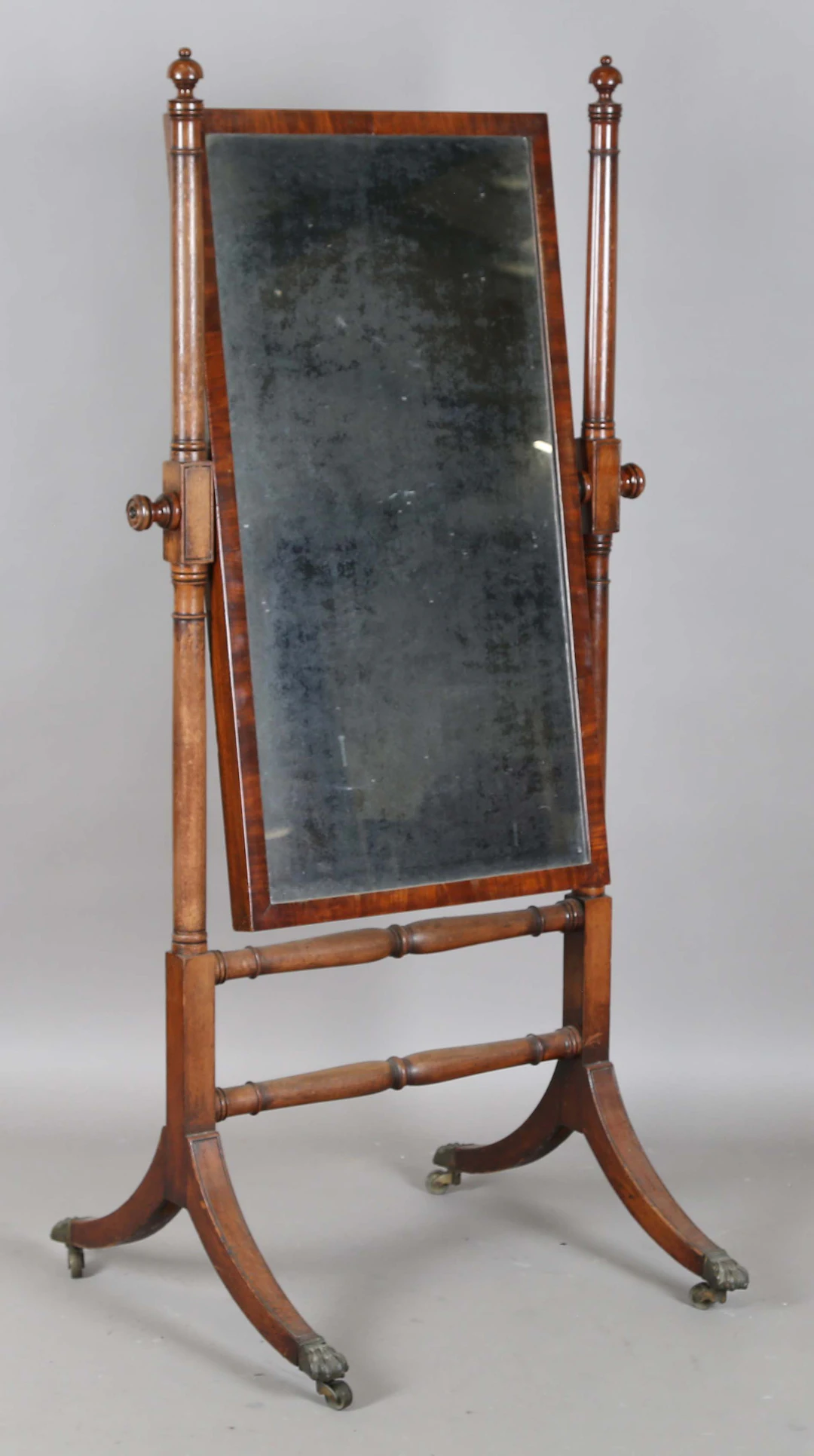 A Regency mahogany cheval mirror with downswept sabre legs, height