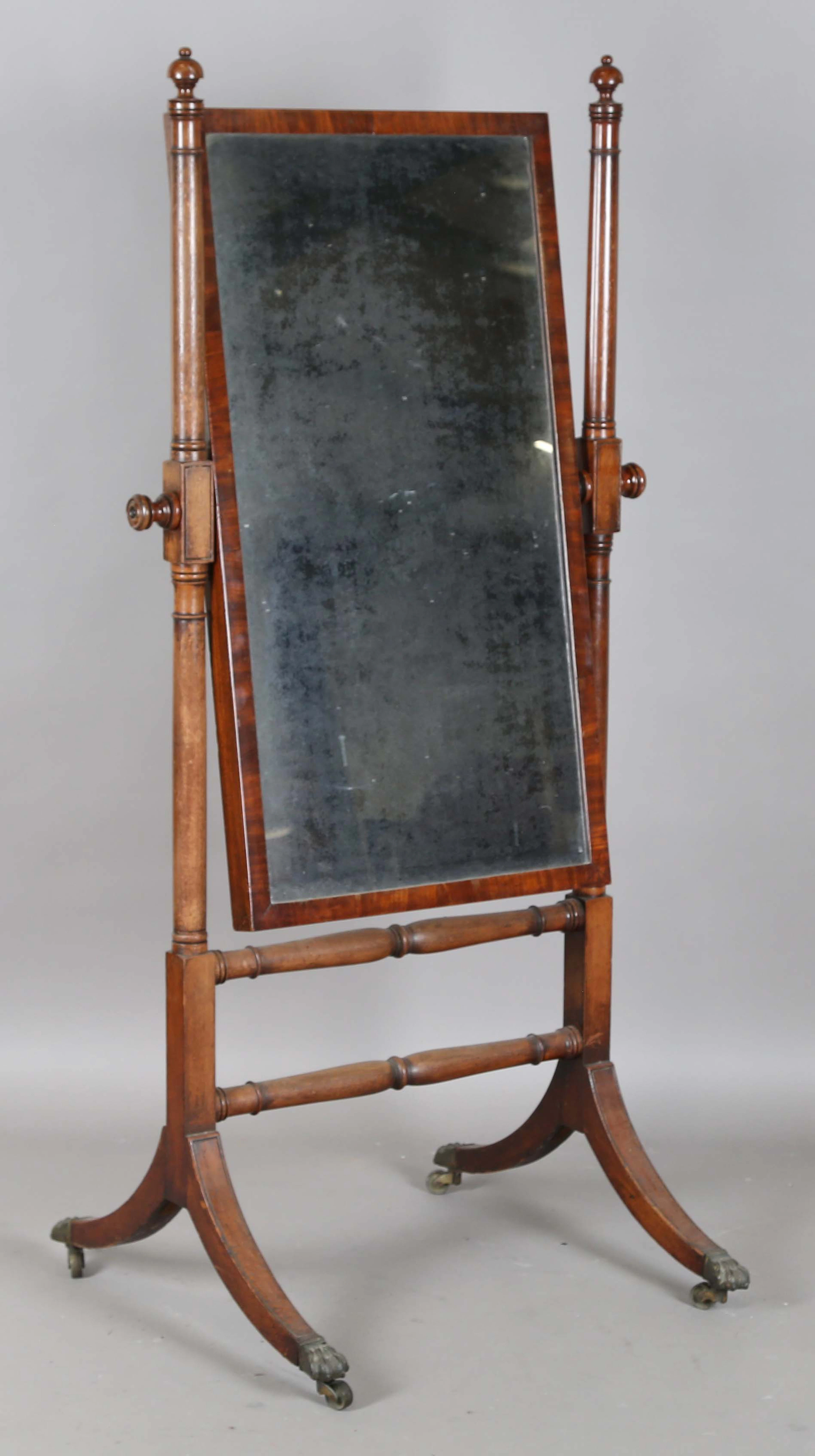 A Regency mahogany cheval mirror with downswept sabre legs, height