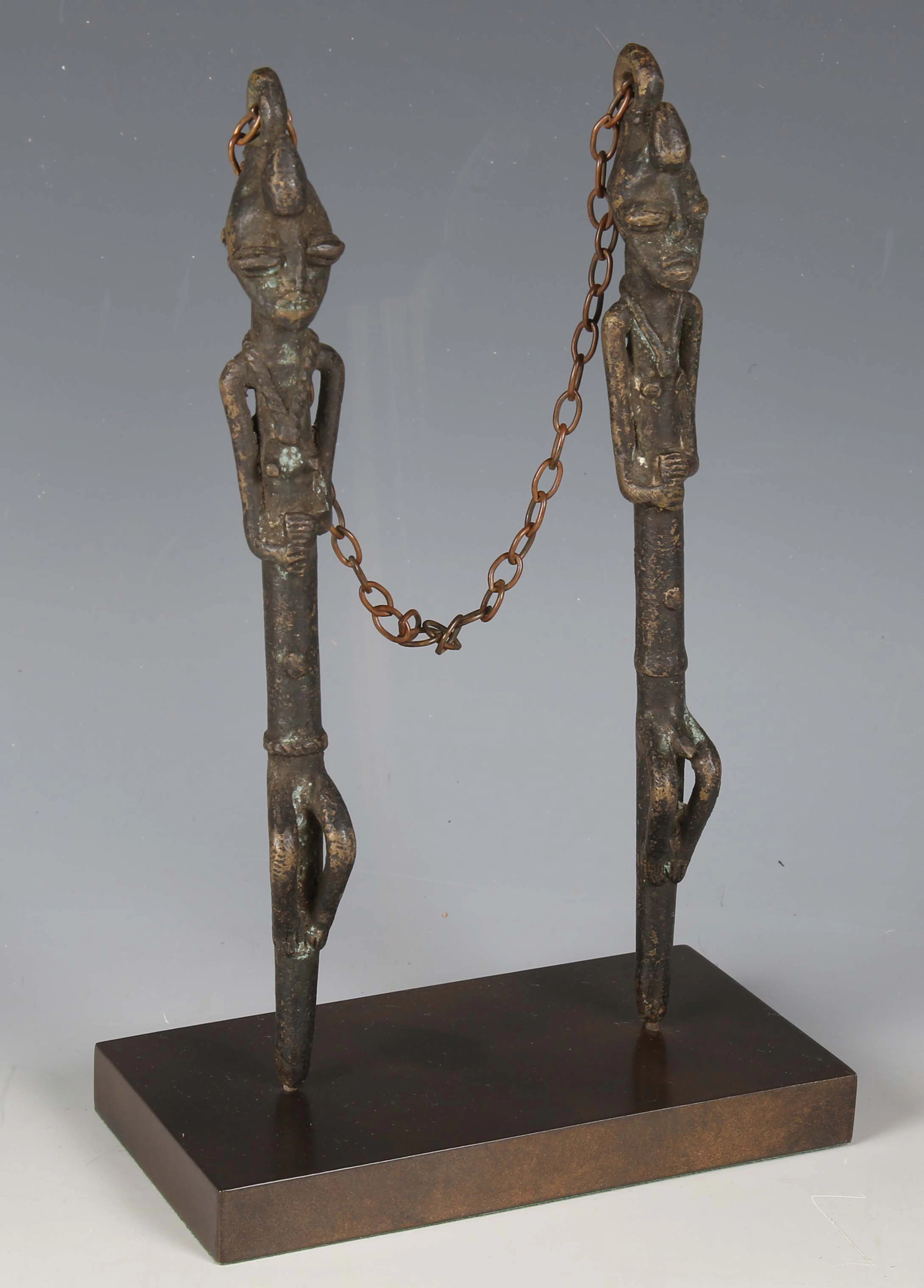 A pair of Yoruba Ogboni Edan cast bronze staves, West Africa, modelled