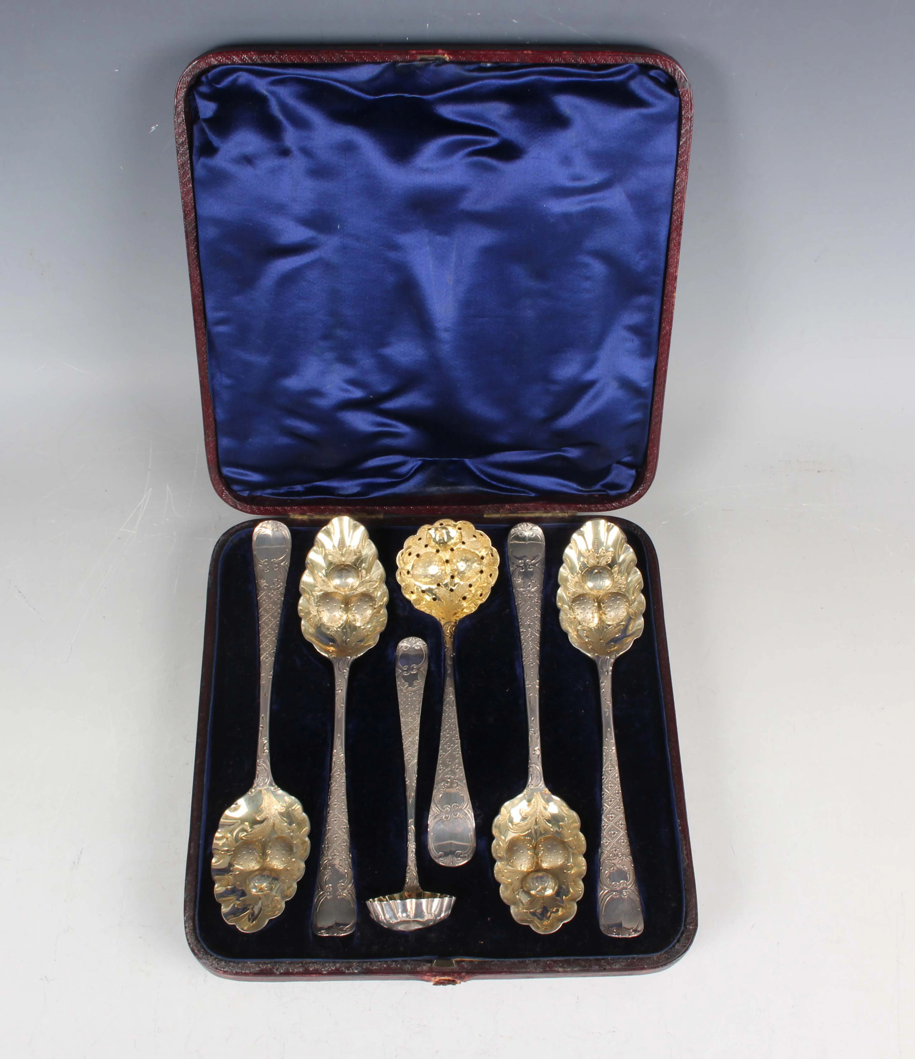 A George III silver harlequin dessert set, comprising four tablespoons