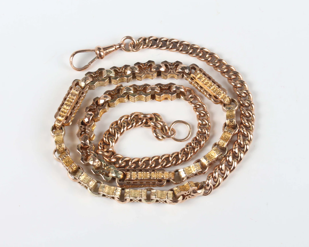 A gold neckchain, formed from two different Albert watch chains, comprising