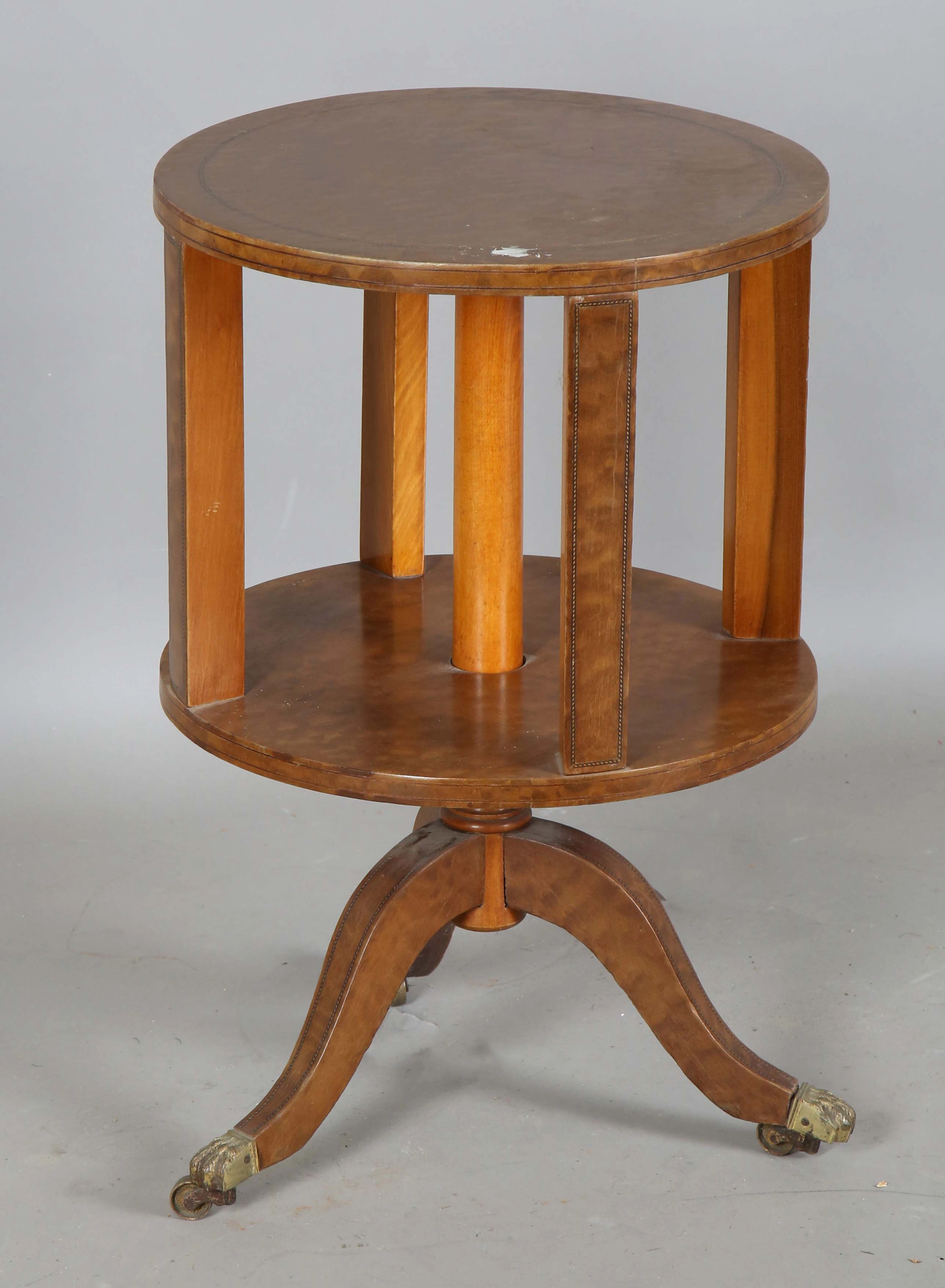 A mid-20th century burr satinwood circular revolving two-tier wine