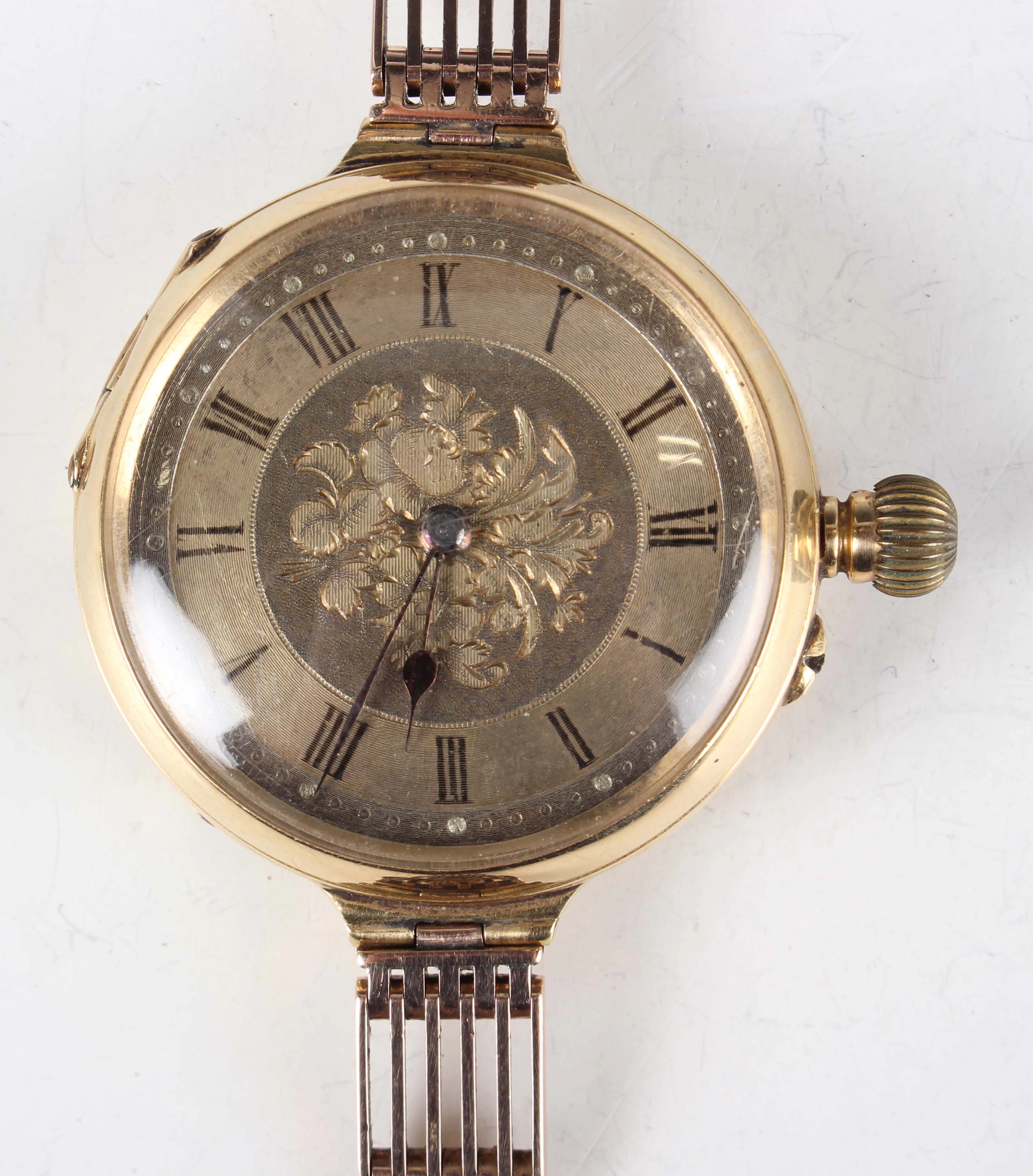 An 18K gold cased keyless wind open-faced fob watch with unsigned