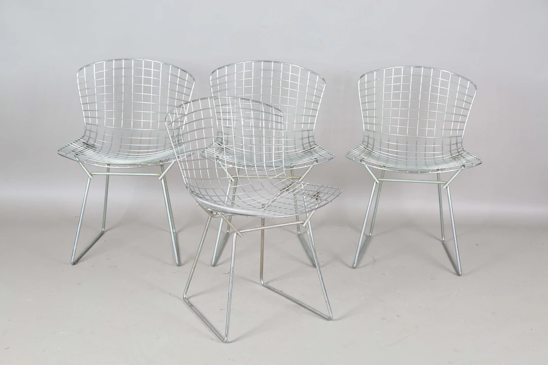 A set of four mid-20th century chromium plated metal mesh chairs
