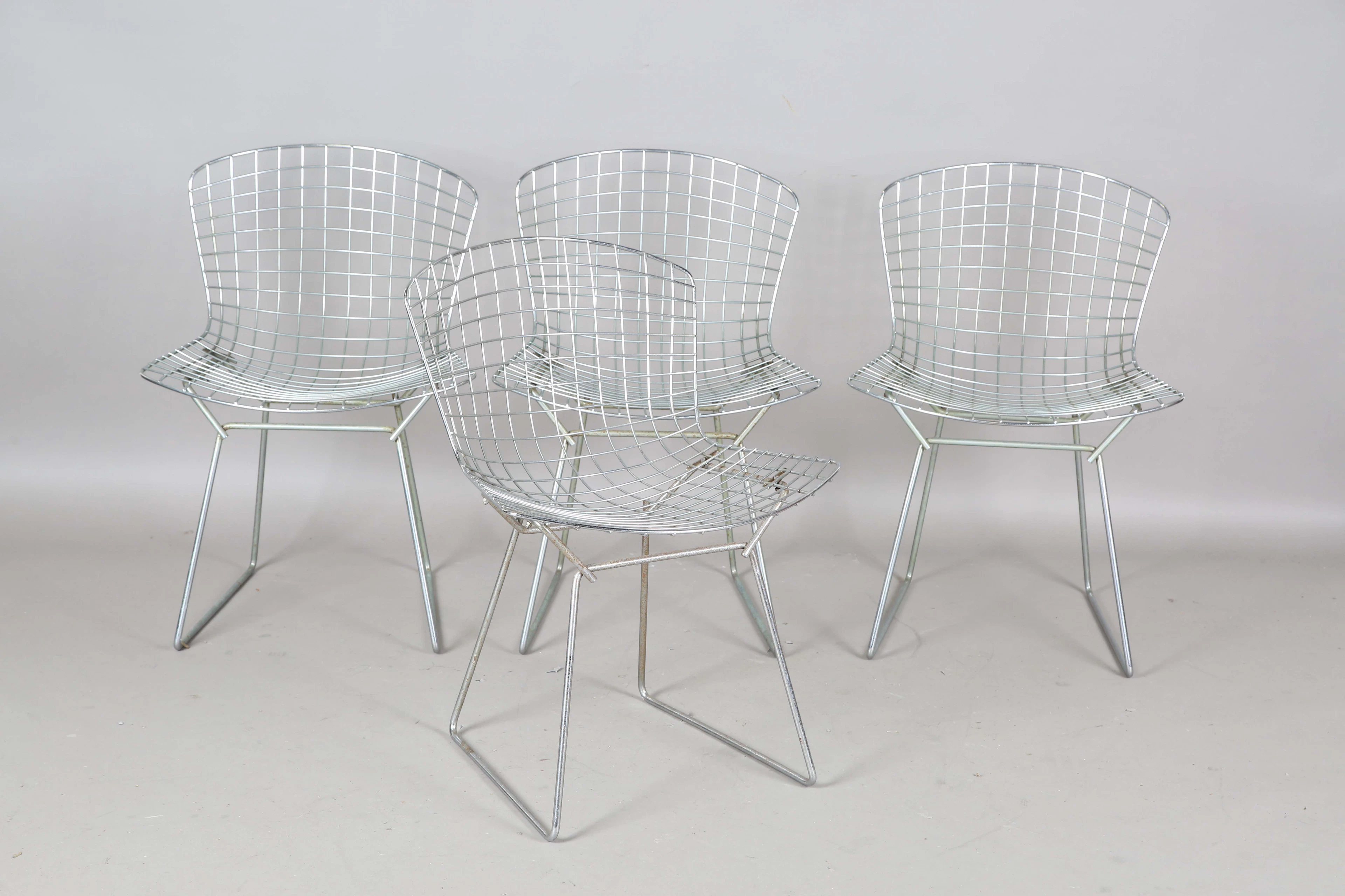 A set of four mid-20th century chromium plated metal mesh chairs