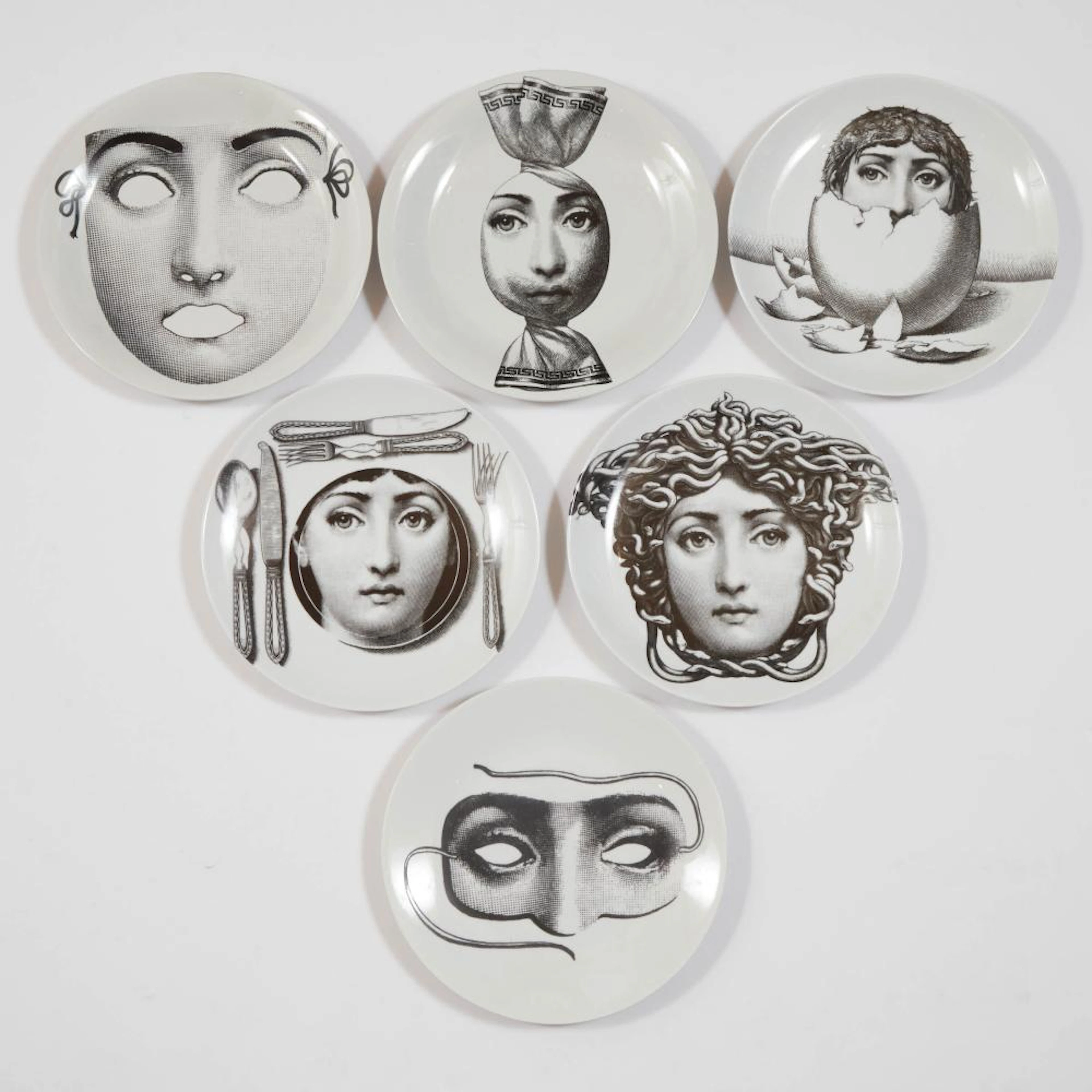 Six Piero Fornasetti 'Tema E Variazioni' Plates, 20th century