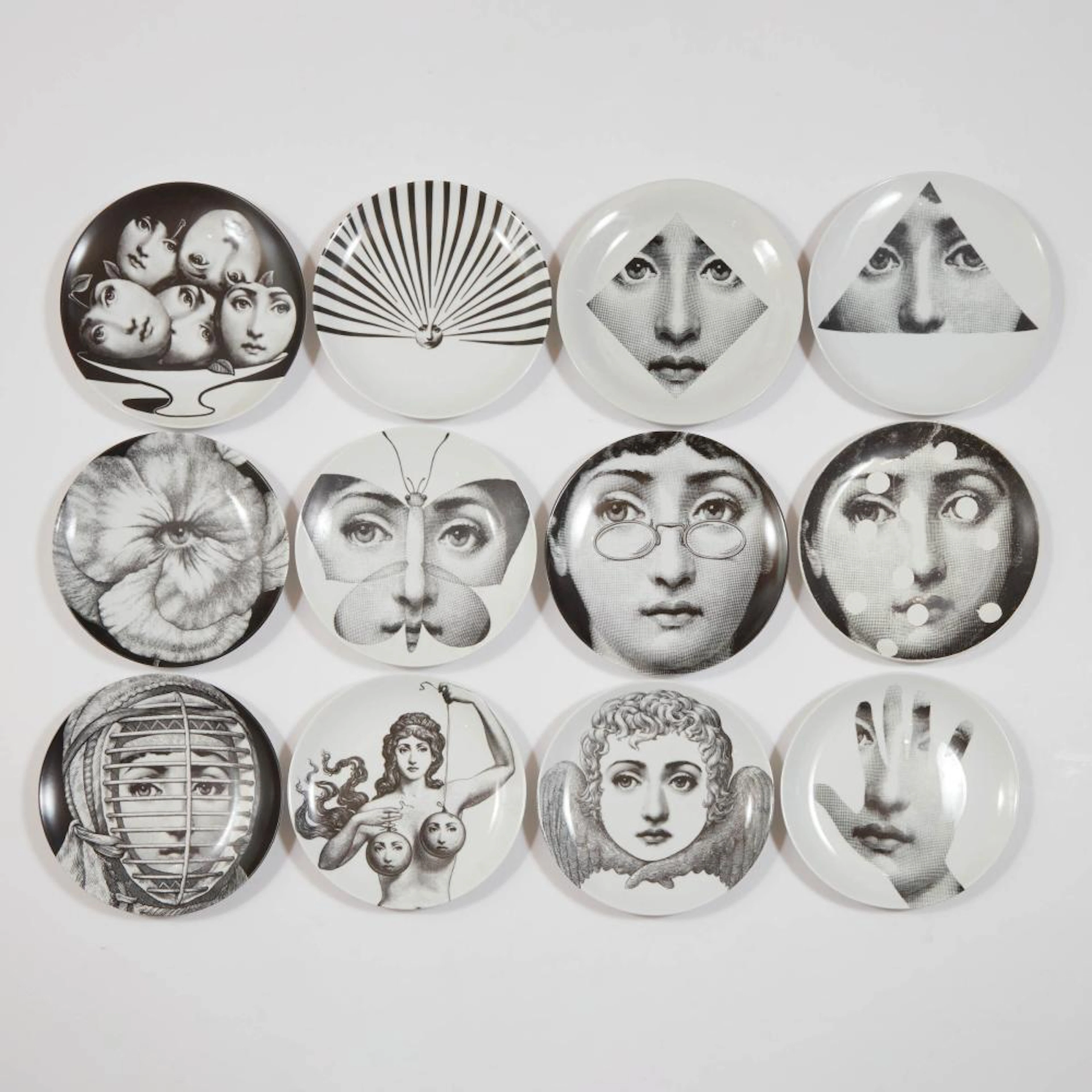 Twelve Piero Fornasetti 'Tema E Variazioni' Plates, 20th century