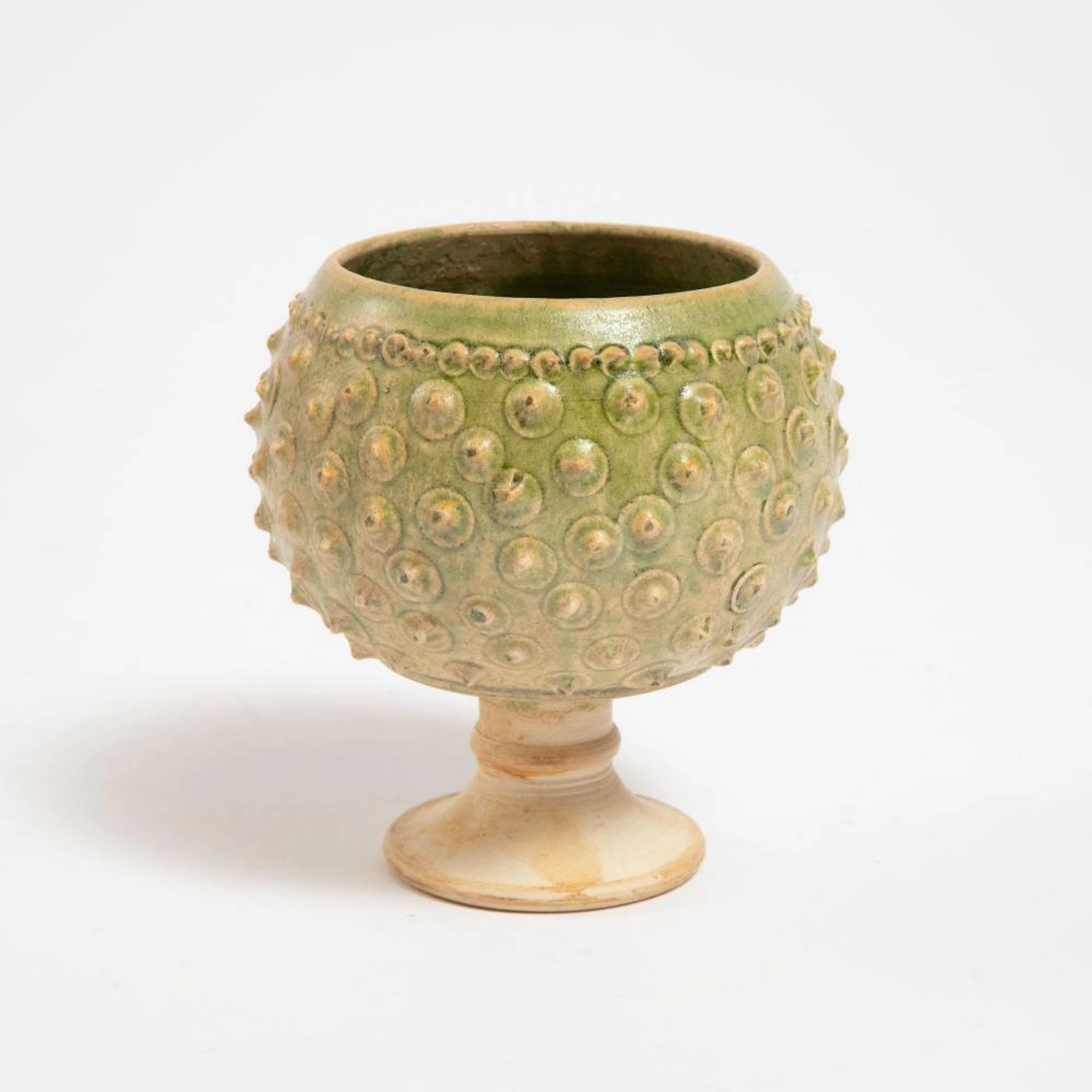 A Rare Green-Glazed Relief-Decorated Stem Cup, Northern Qi Dynasty