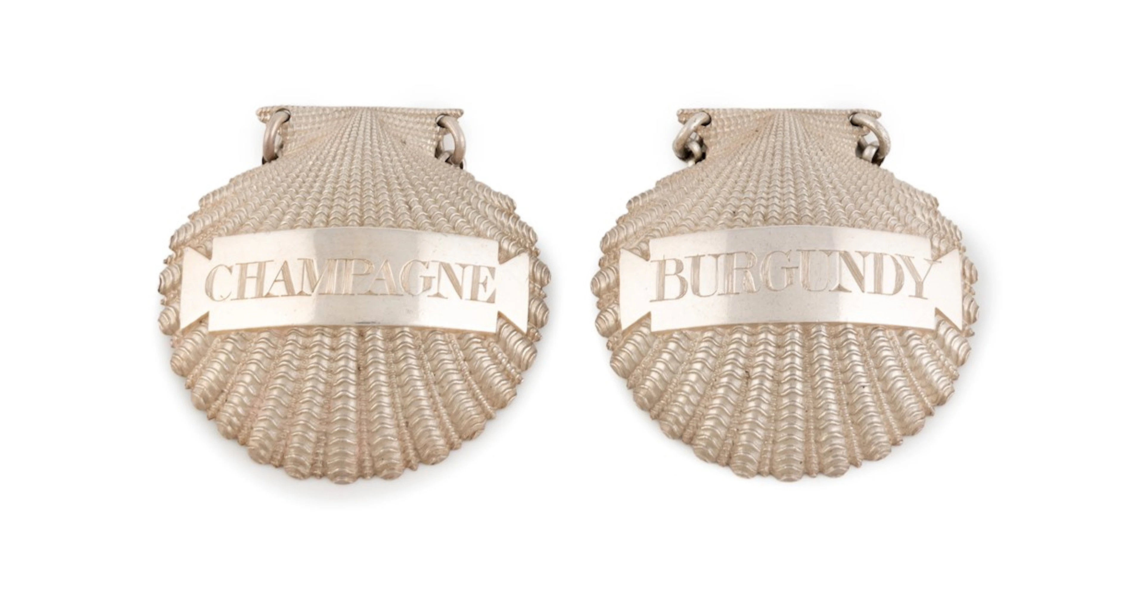 A pair of George III cast silver wine labels