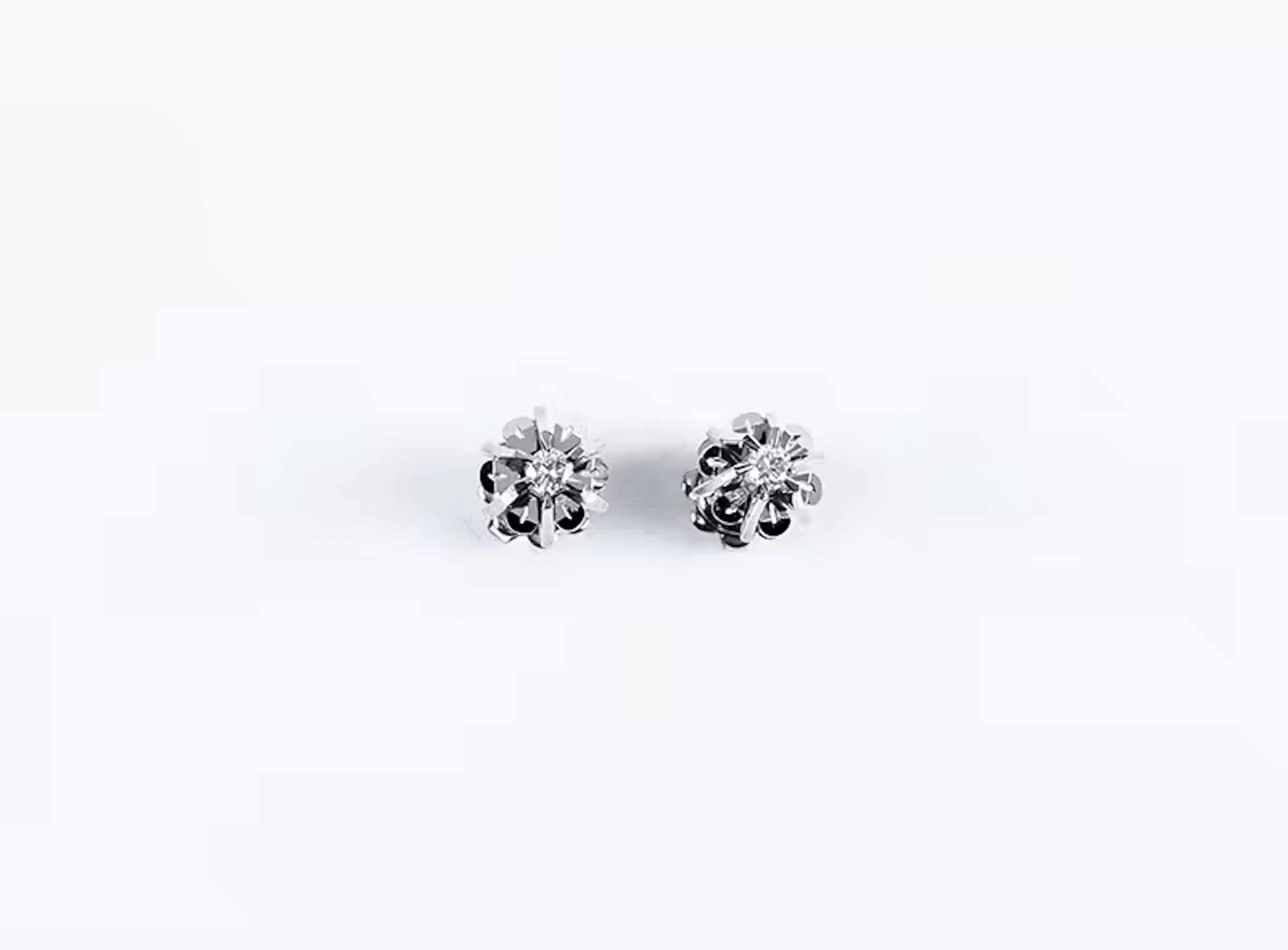 Pendientitos solitarios vintage en oro blanco 18 K