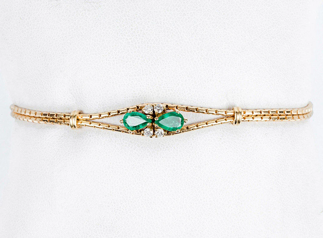 Pulsera en doble cordón de oro amarillo 18 K con centro...