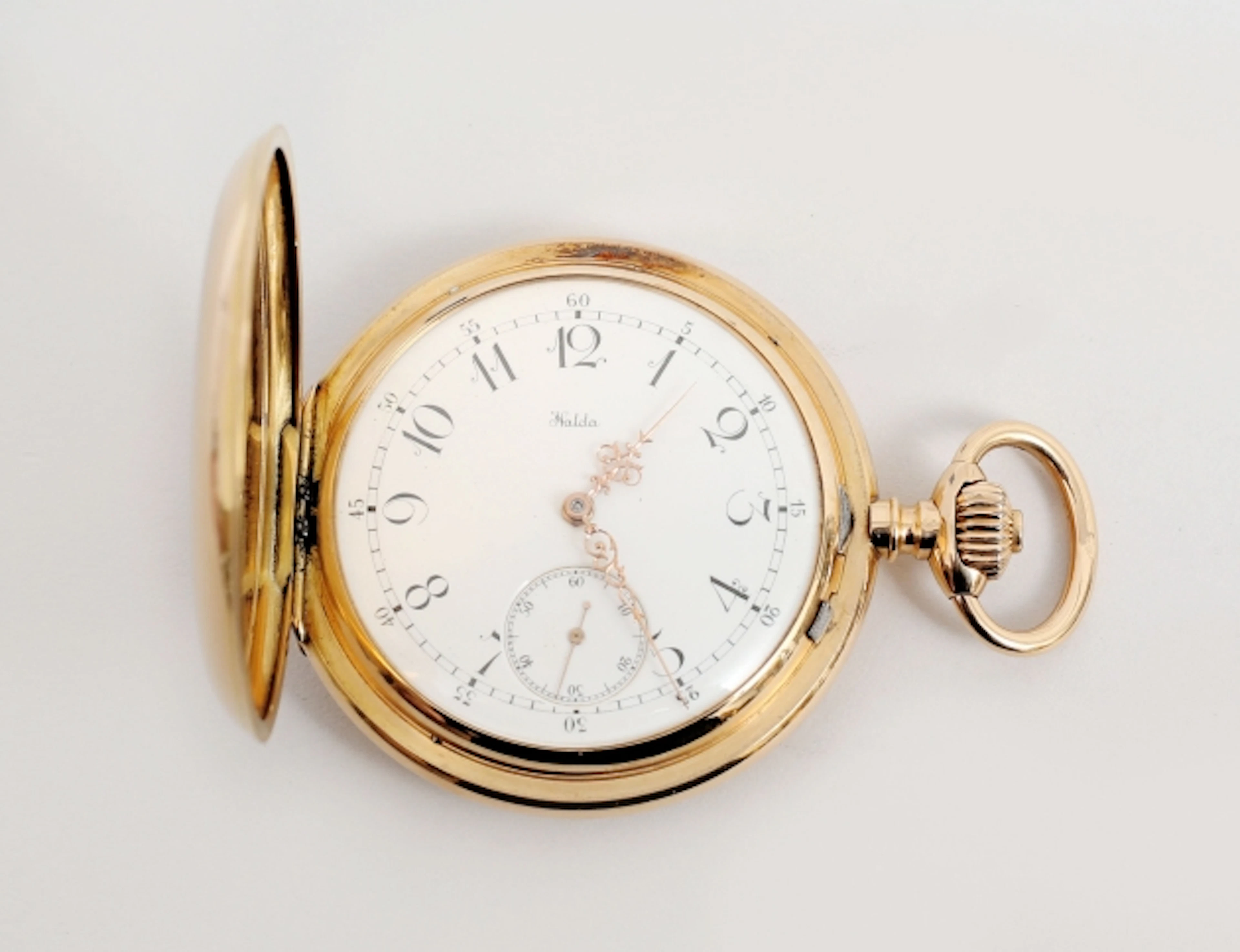 Fickur Halda savonett 18k