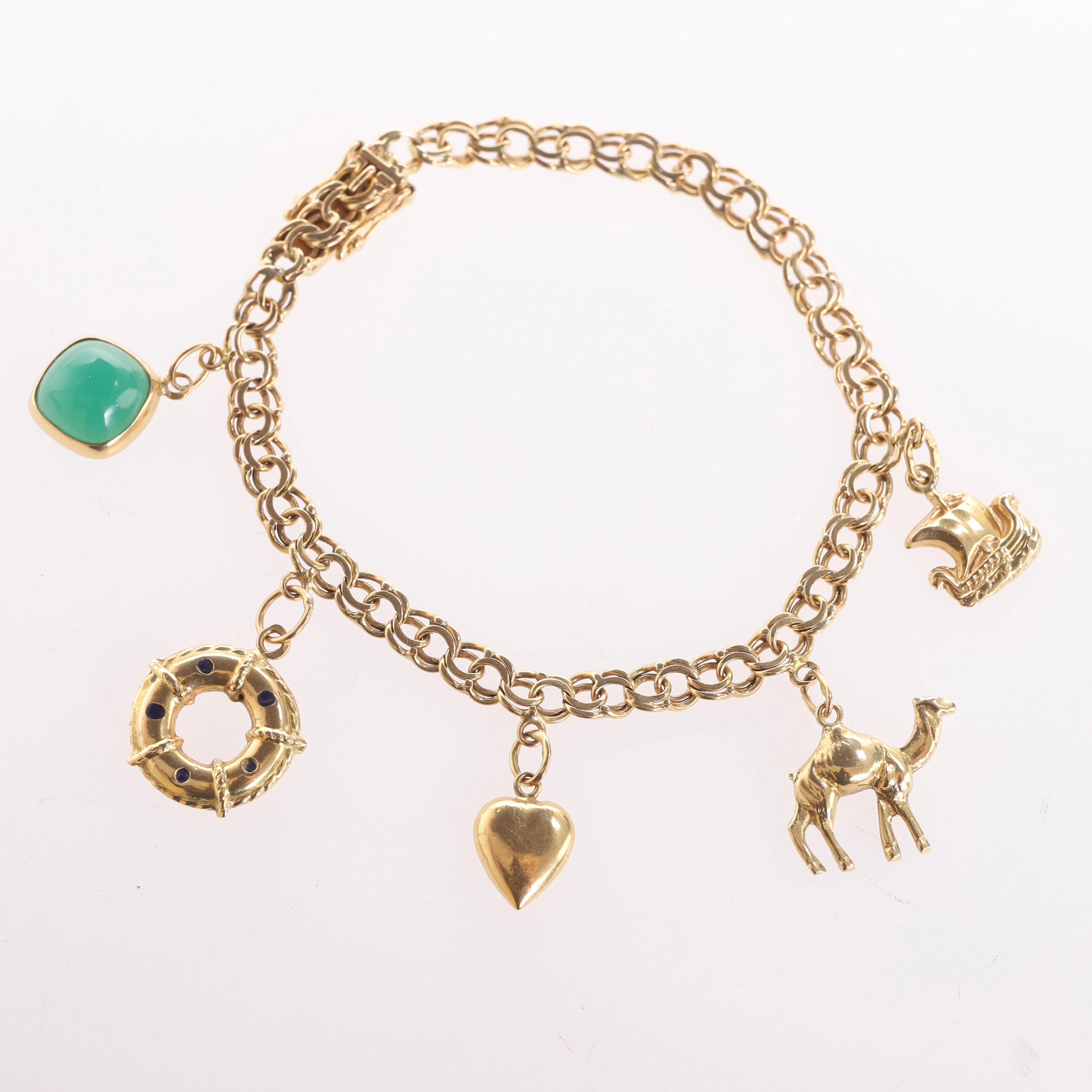 ARMBAND MED BERLOCKER, Bismarck, 18 k guld.